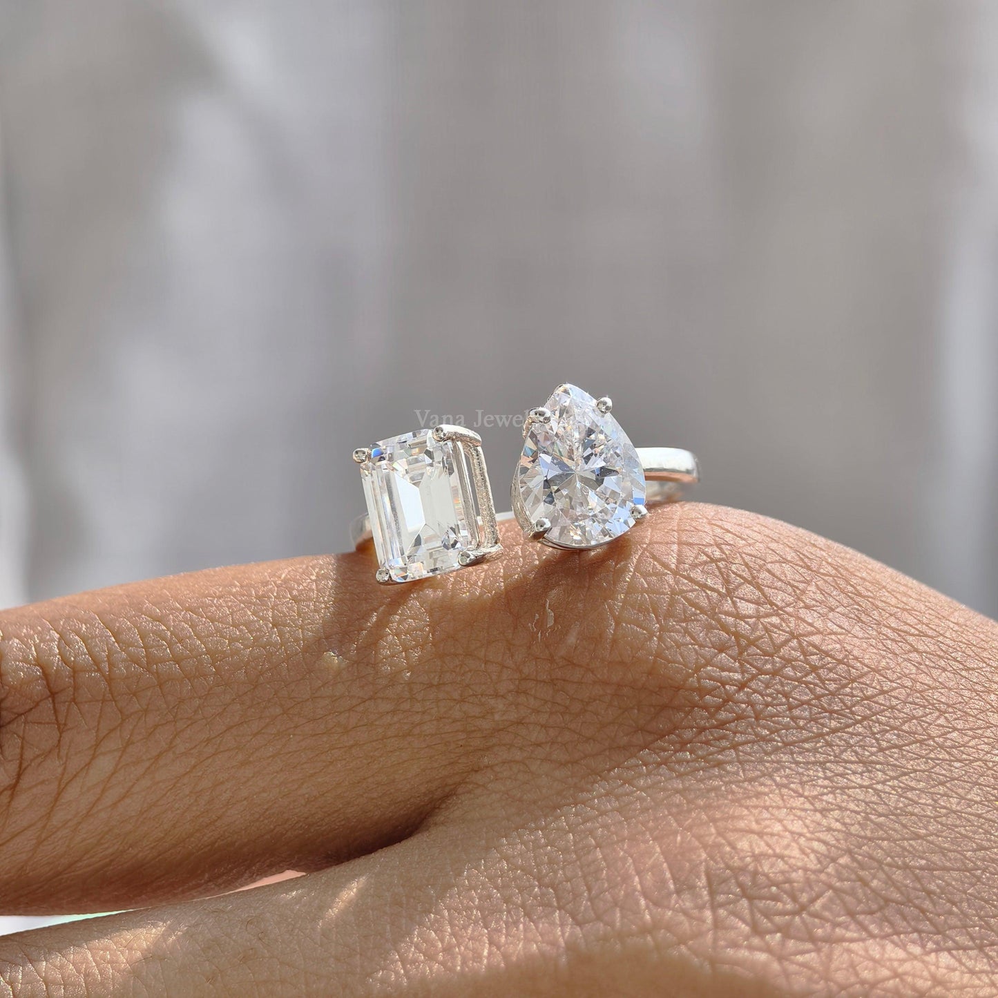 Toi et moi ring with pear and emerald cut moissanite in white gold