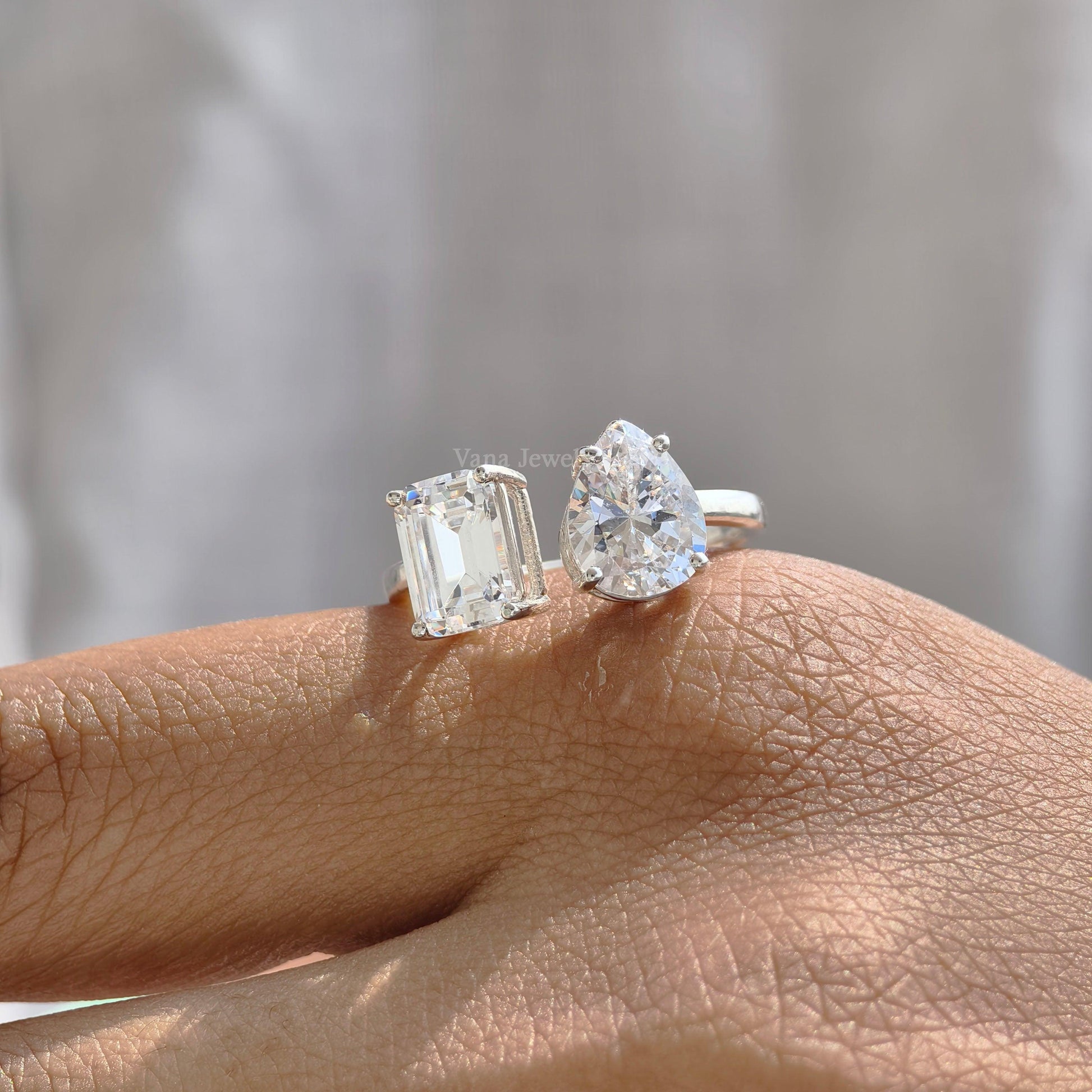 Toi et moi ring with pear and emerald cut moissanite in white gold