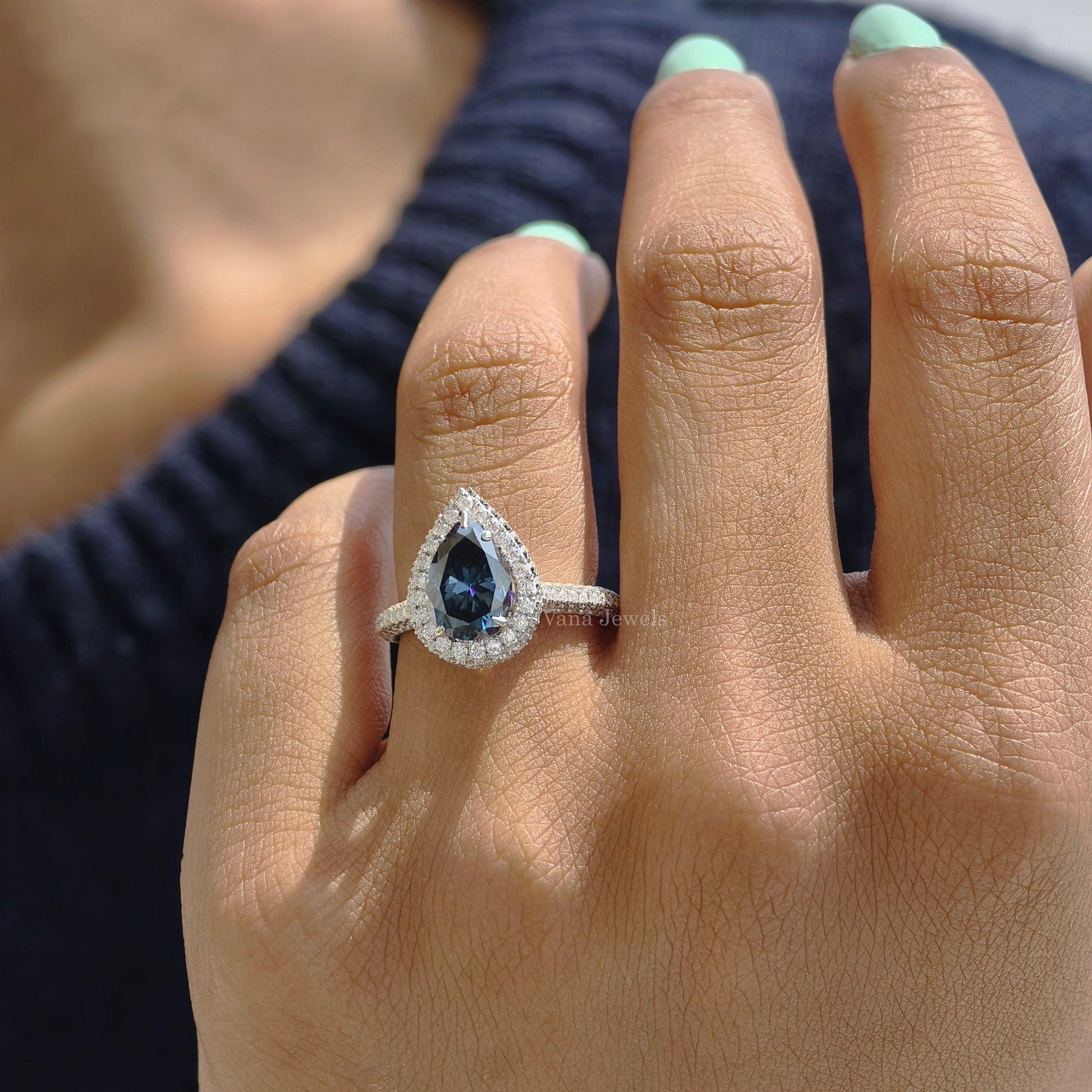 Royal blue pear cut moissanite halo engagement ring