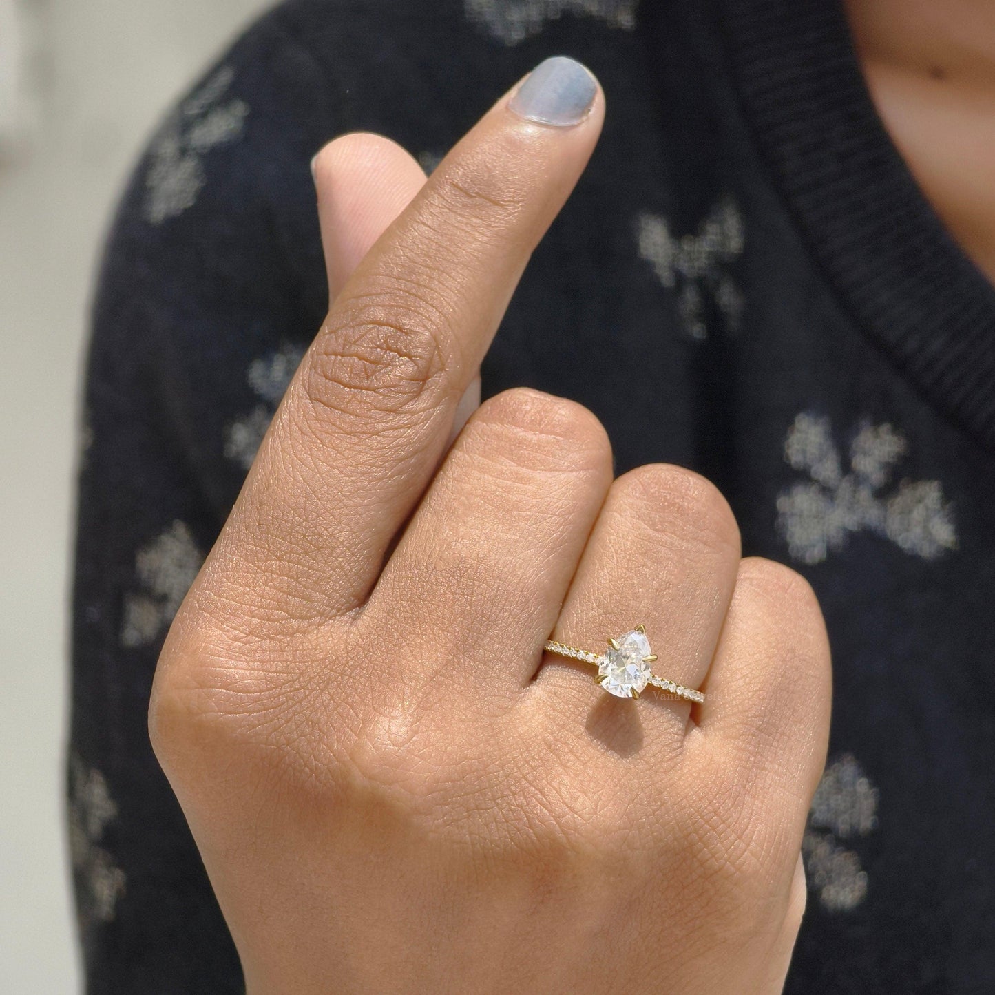 Pear cut moissanite claw prong set ring