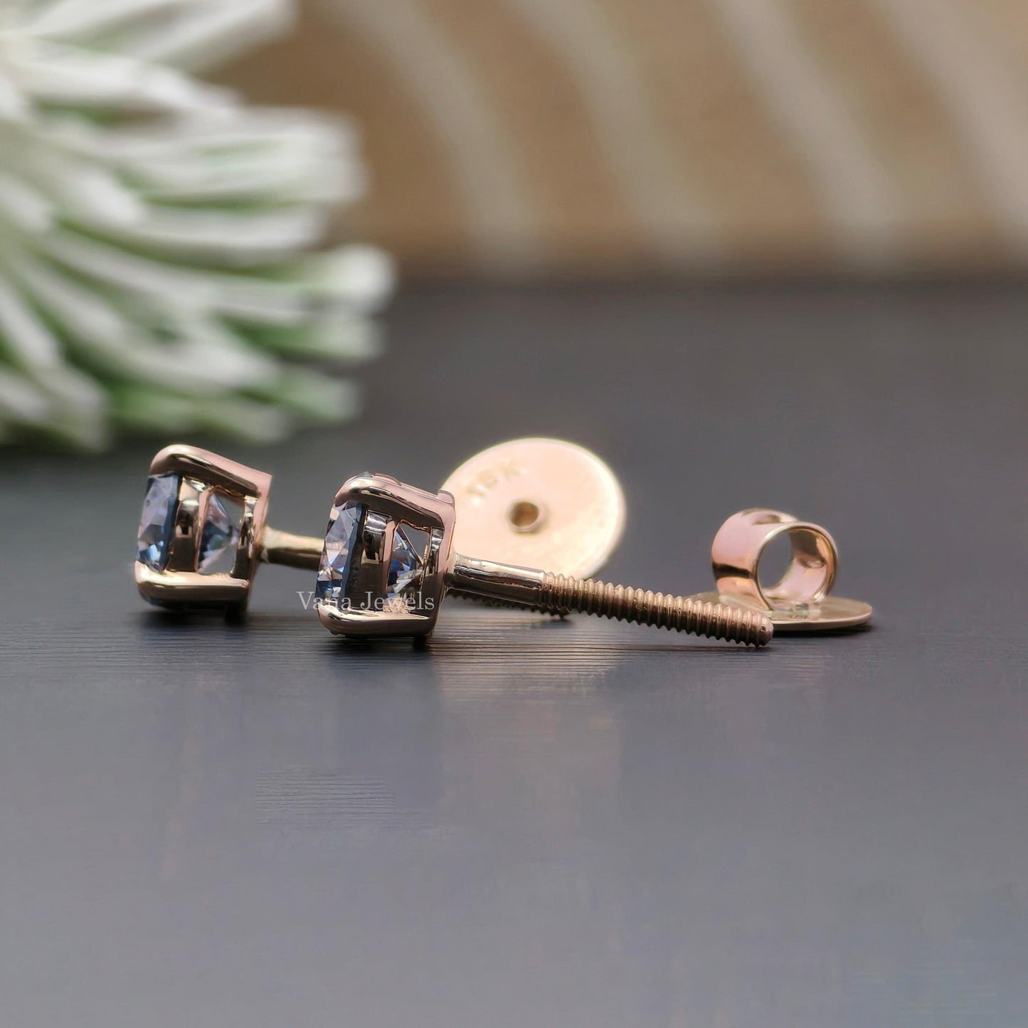 Royal blue moissanite stud earrings with round cut stones in rose gold