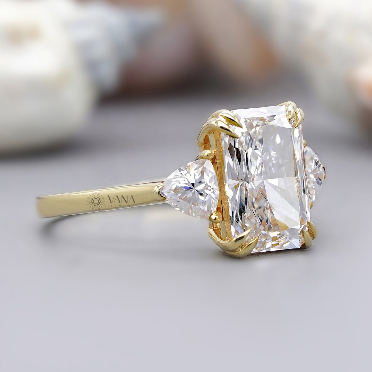 Three-stone radiant cut moissanite ring for engagement or anniversary