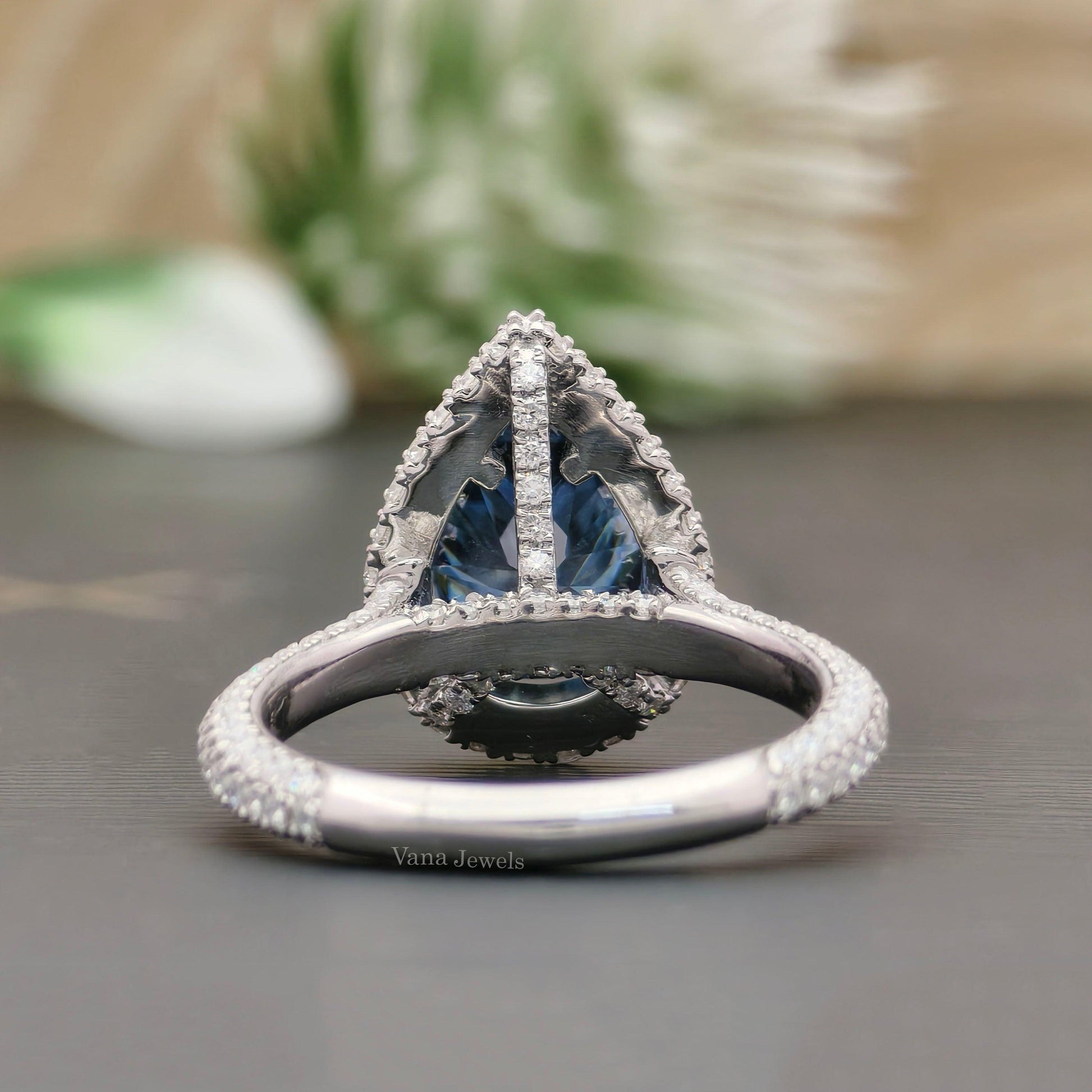 Halo pear moissanite ring in white gold
