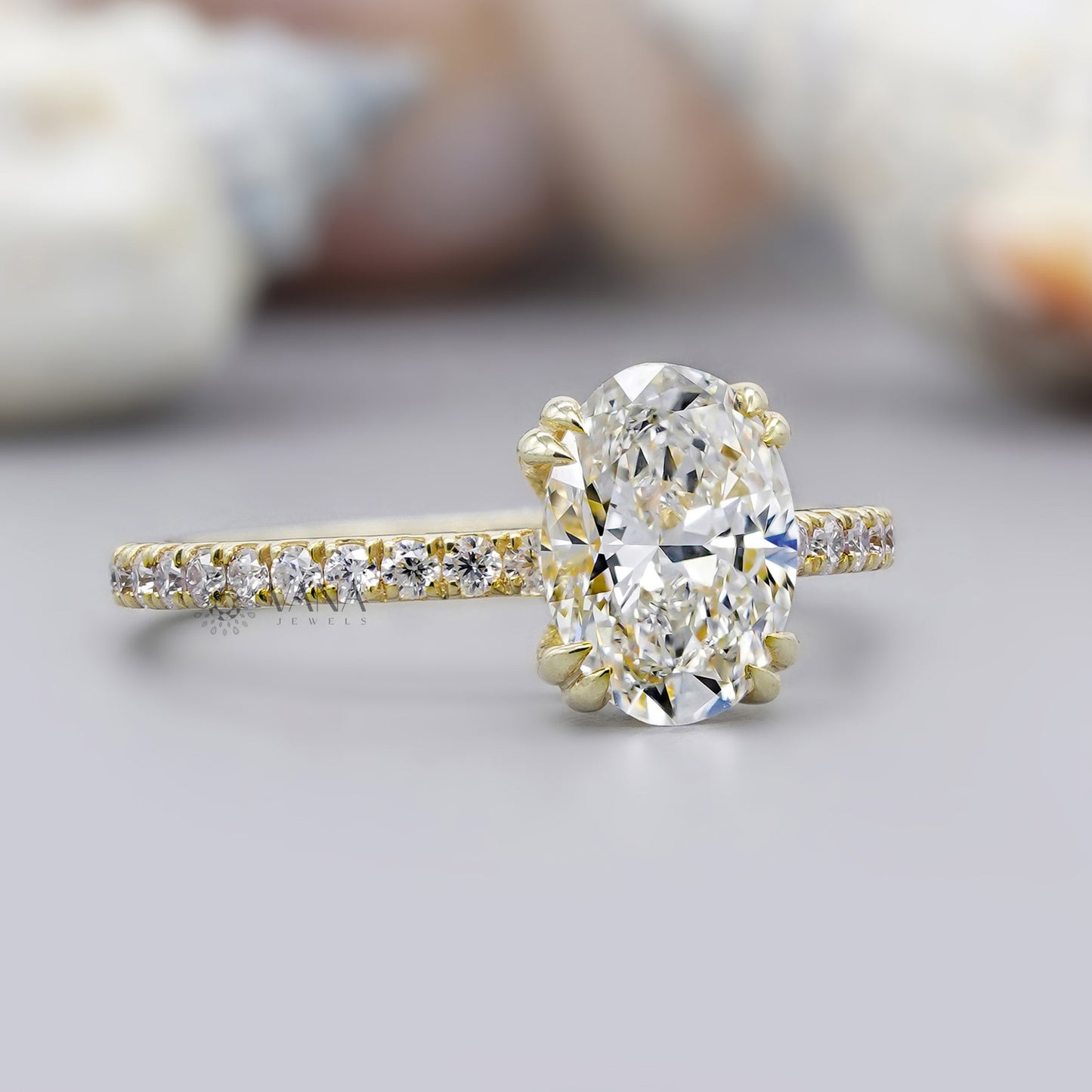14K yellow gold oval cut moissanite engagement ring with minimalist hidden halo