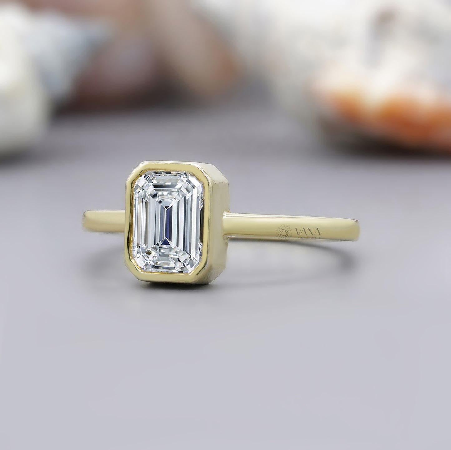 Solitaire engagement ring featuring emerald cut moissanite