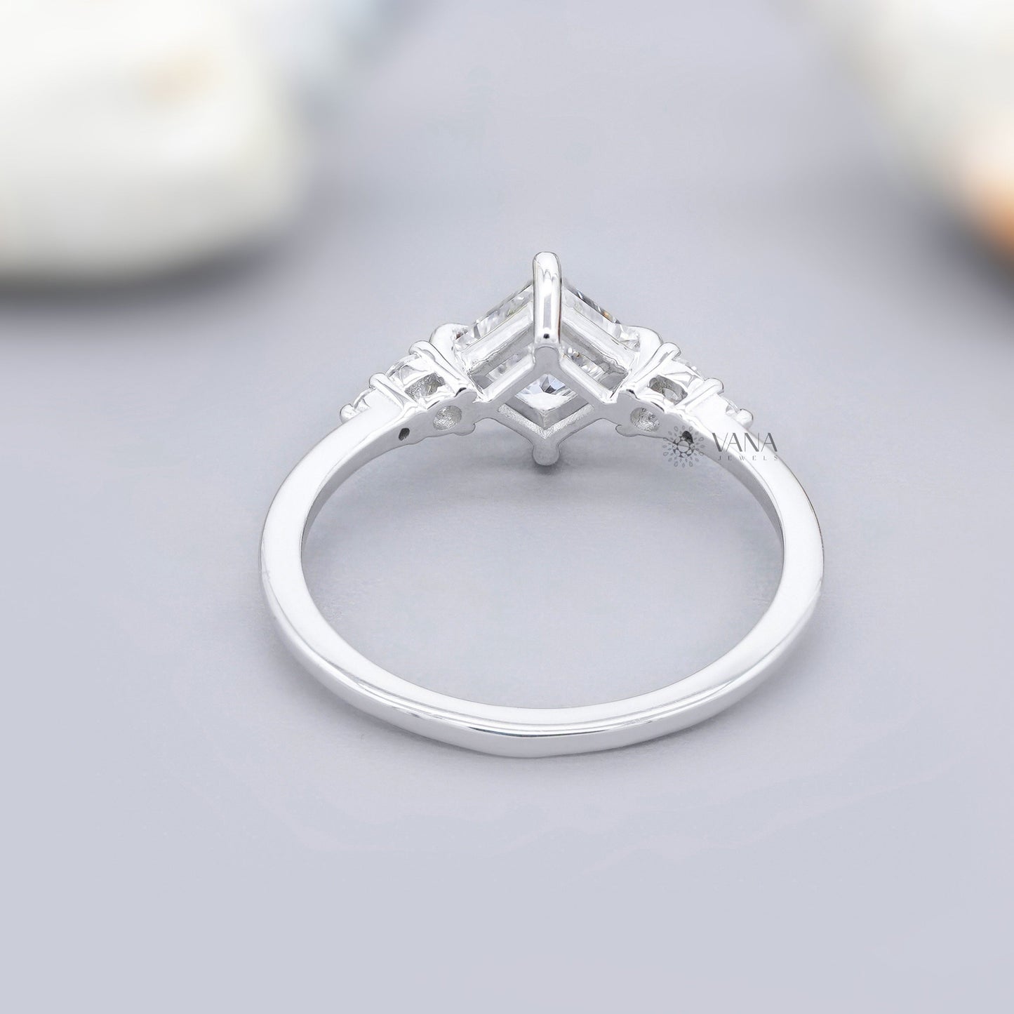 Five stone moissanite engagement ring with princess cut center