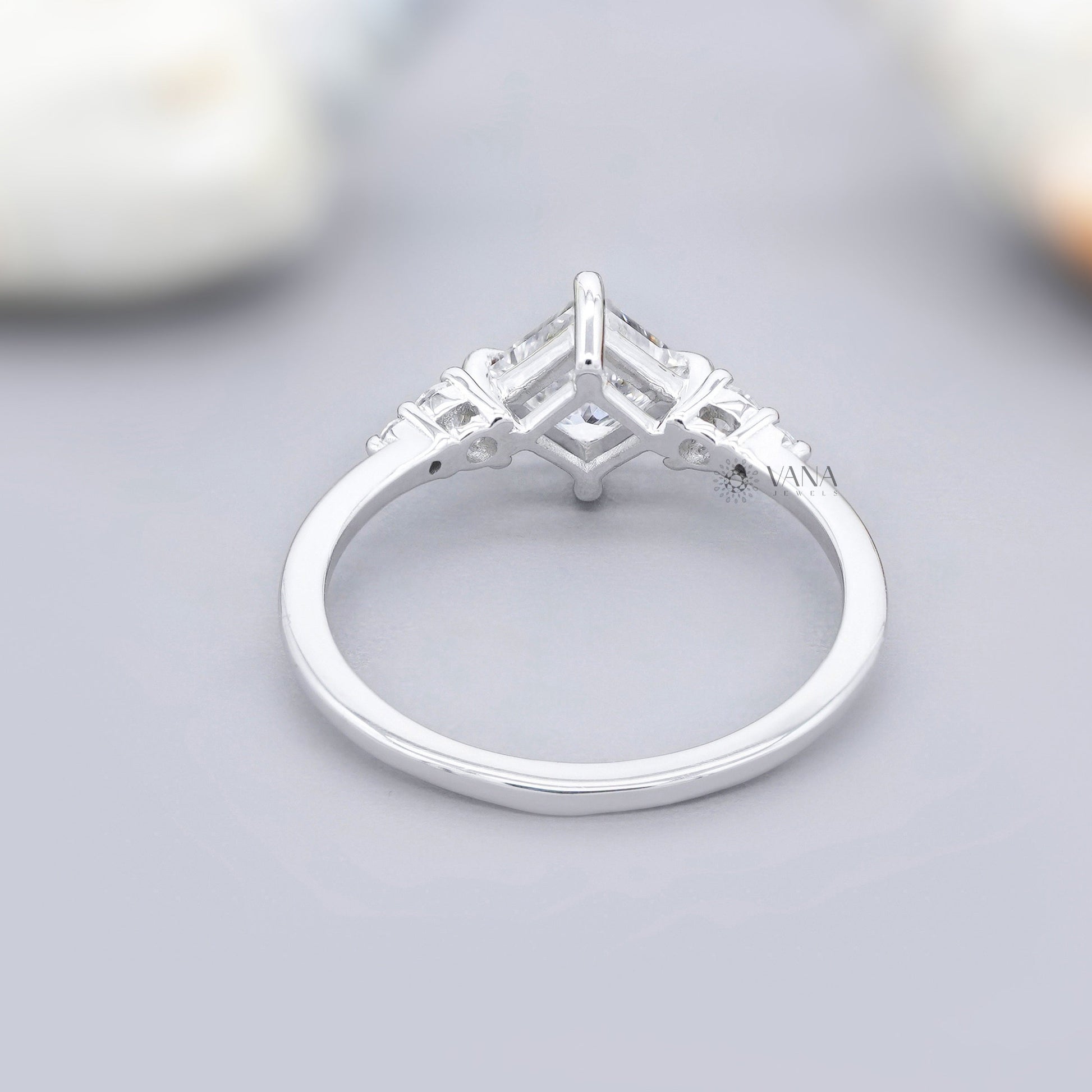 Five stone moissanite engagement ring with princess cut center