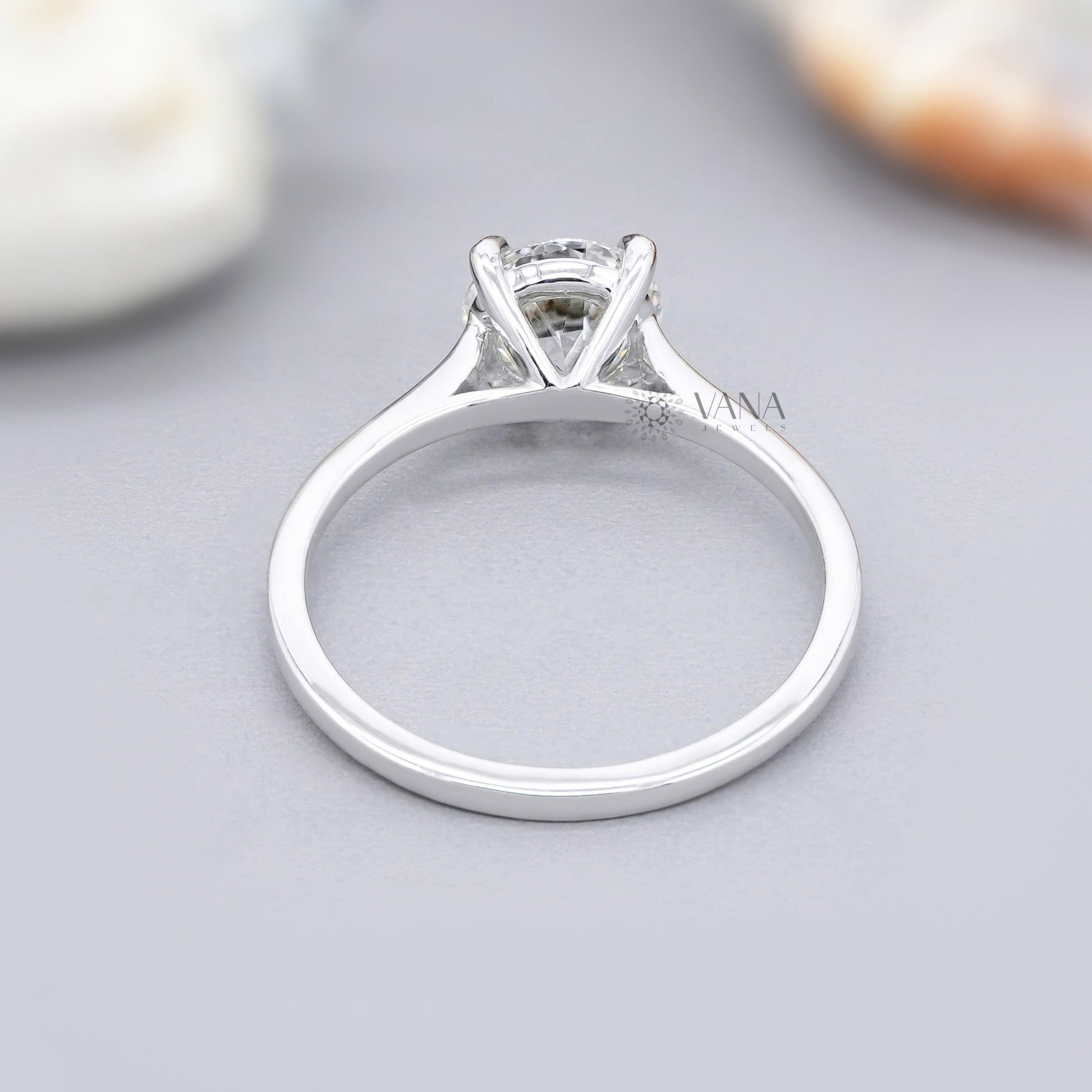 Simple moissanite proposal ring