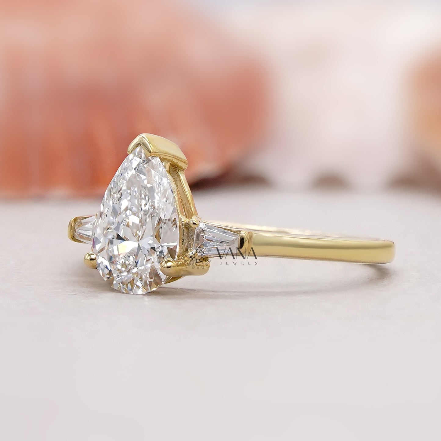 Pear Cut Diamond Engagement Ring with Tapered Baguette