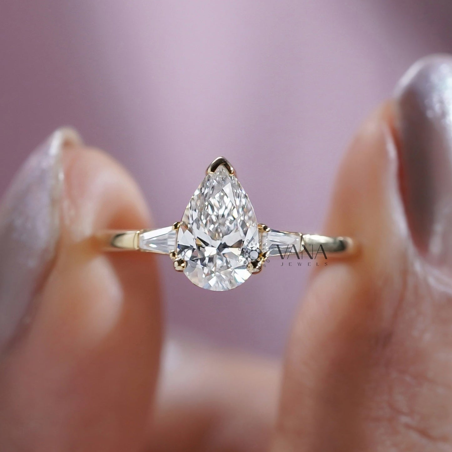 Pear Cut Moissanite Three Stone Engagement Ring with Tapered Baguette Side Stones