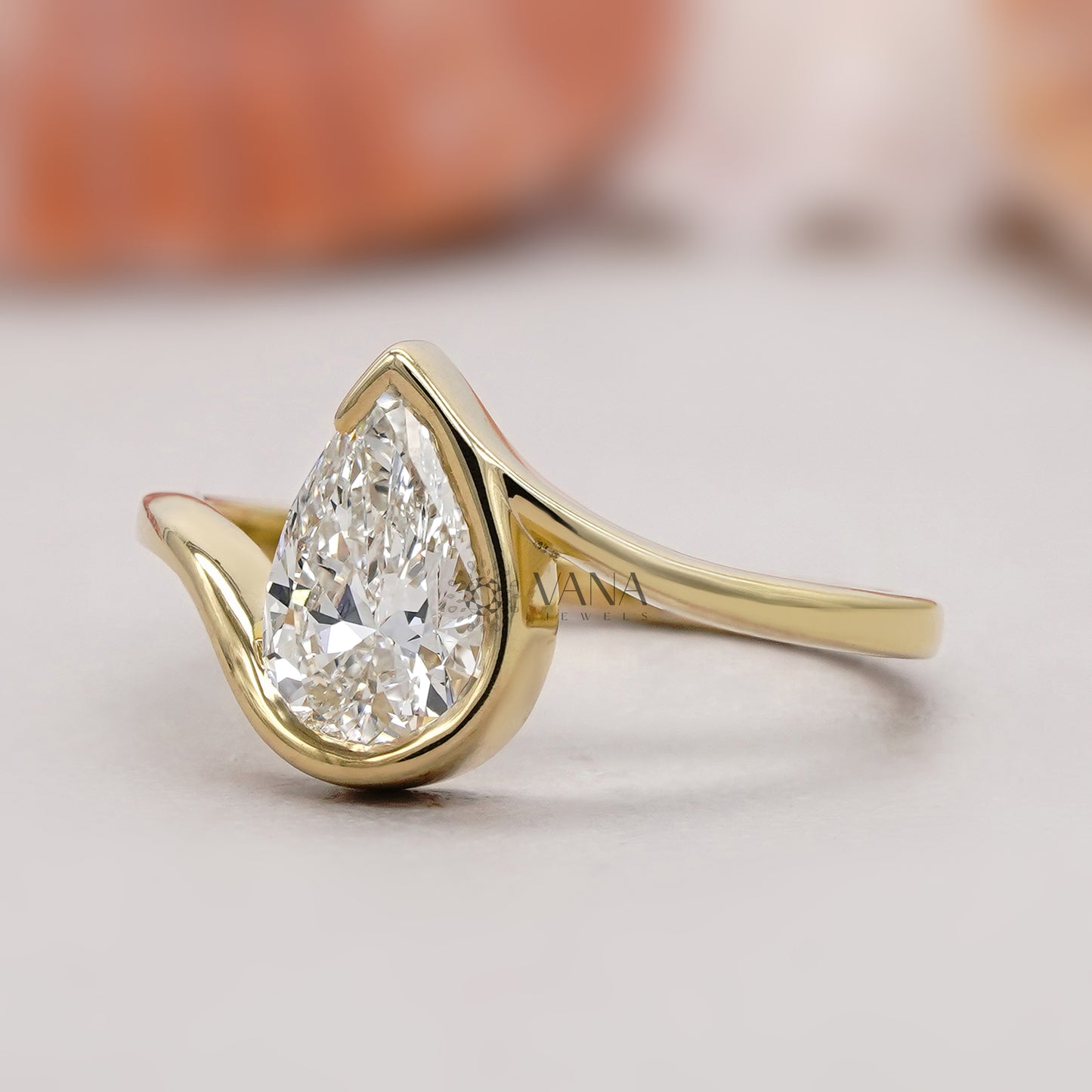 Half Bezel Pear Solitaire Ring