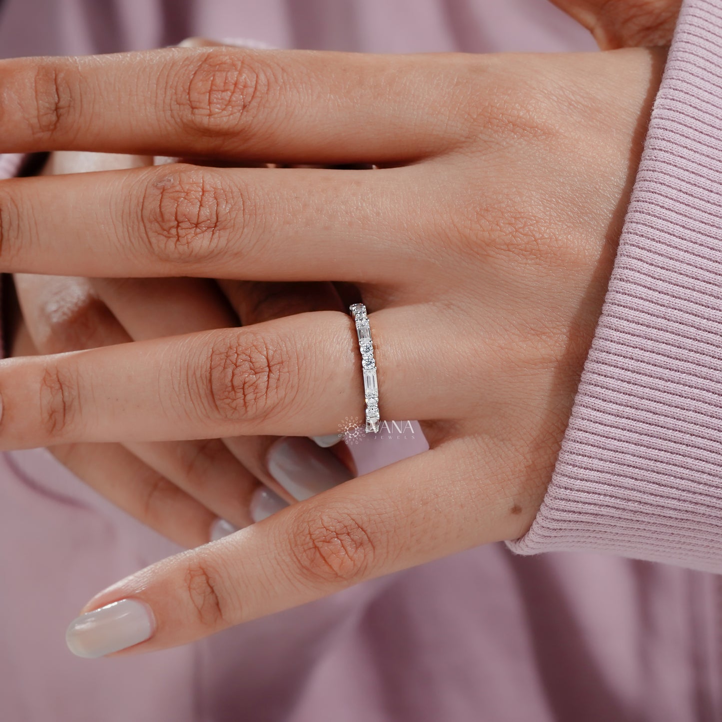 Round and baguette diamond ring