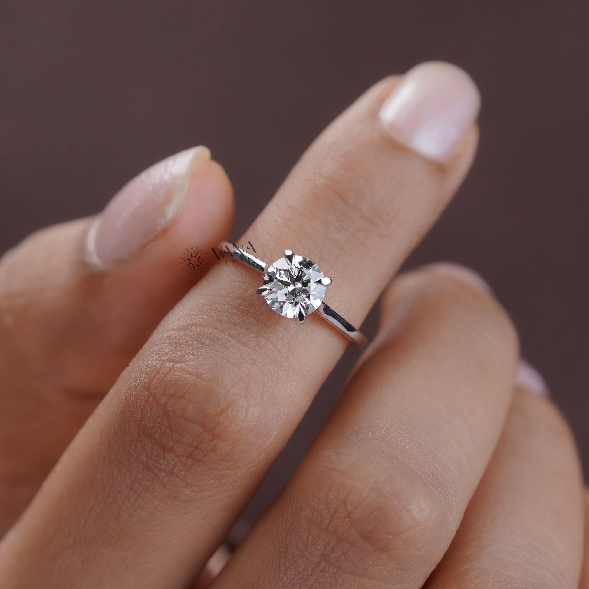 Round cut moissanite solitaire engagement ring in white gold minimalist setting
