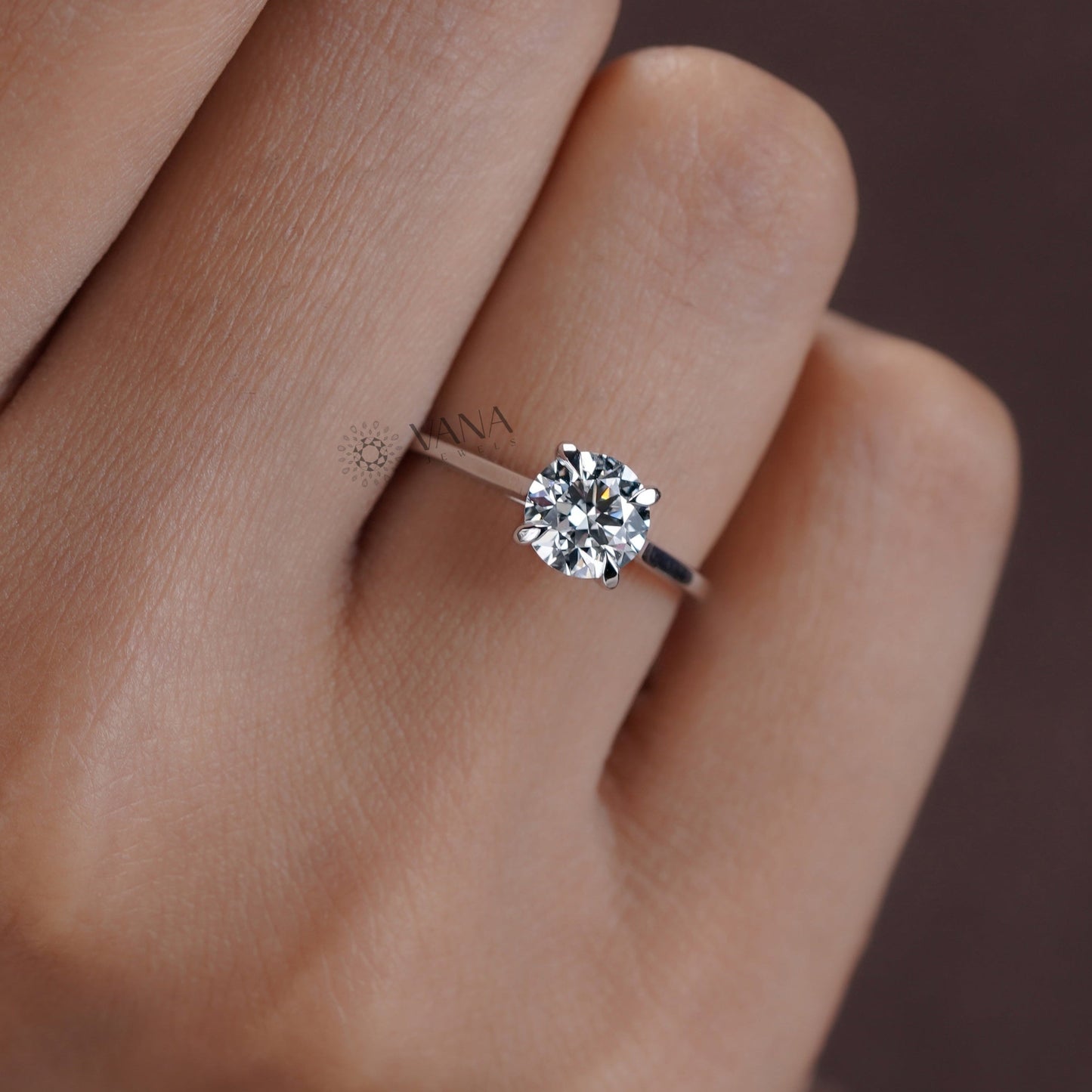 Moissanite solitaire ring in a modern four-prong setting on white gold