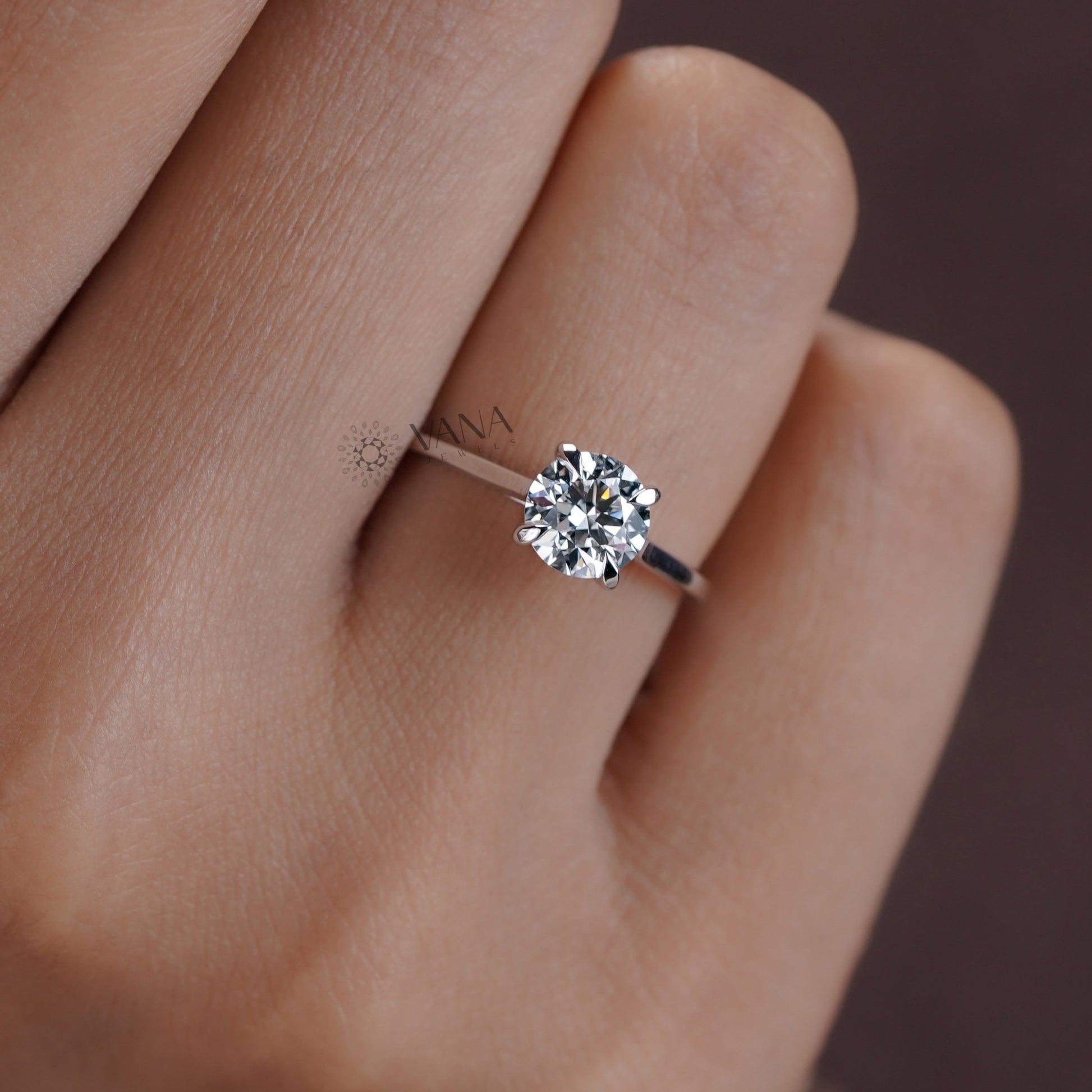 Moissanite solitaire ring in a modern four-prong setting on white gold