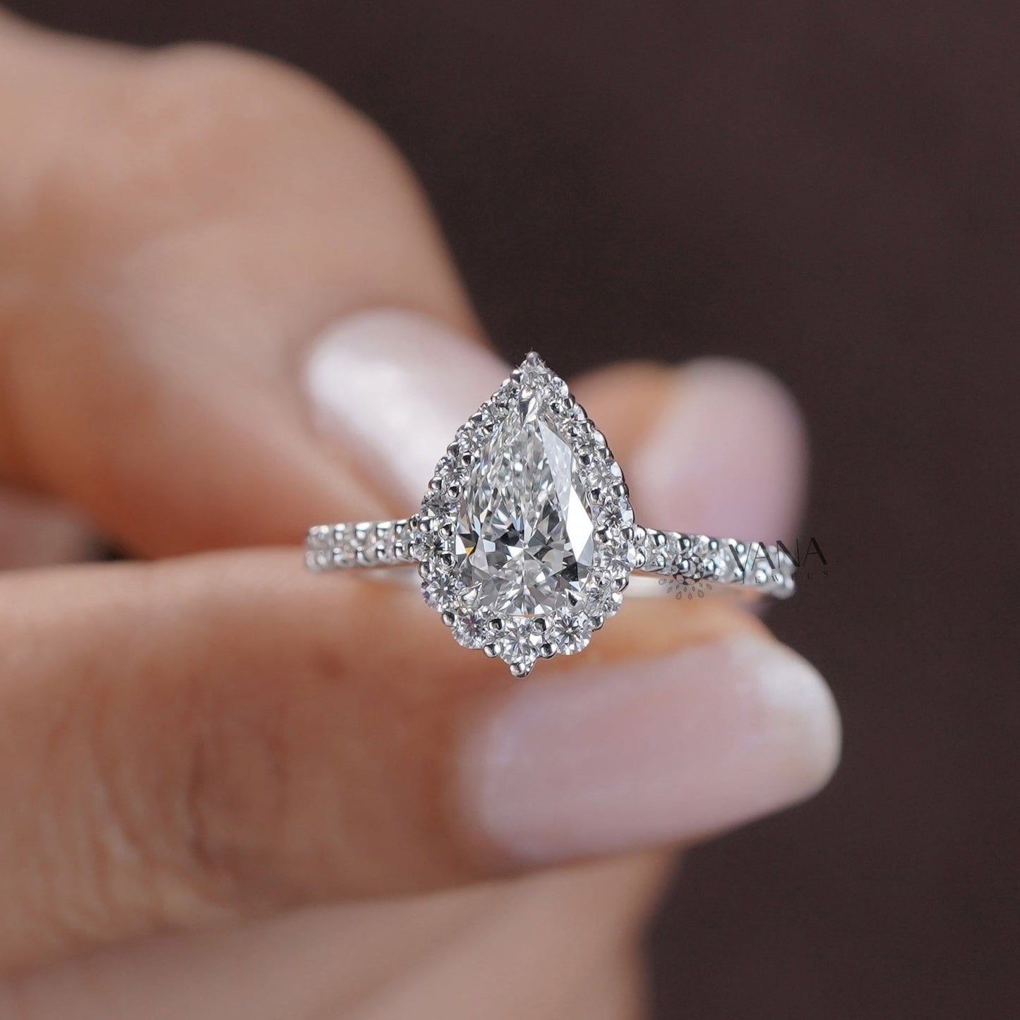 14K white gold pear halo engagement ring with dazzling moissanite stone