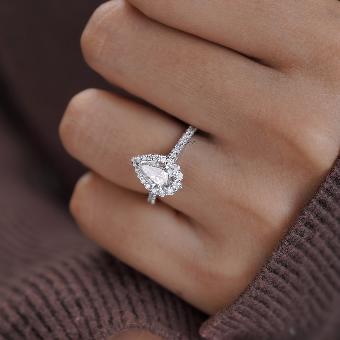 Sparkling pear moissanite engagement ring