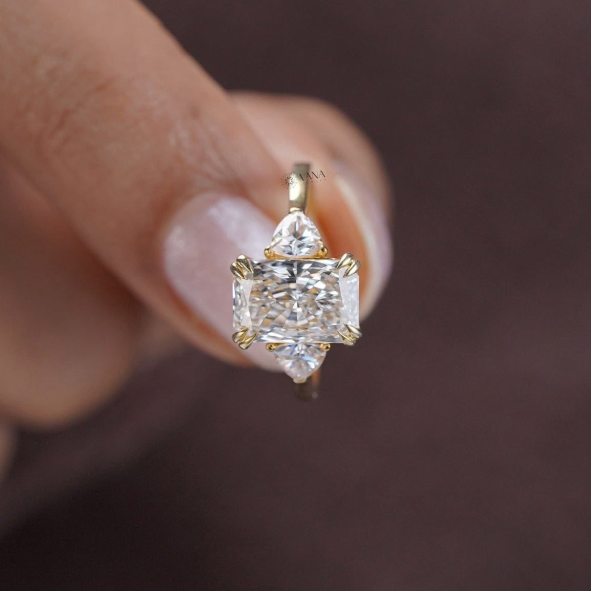 Elegant three-stone moissanite engagement ring