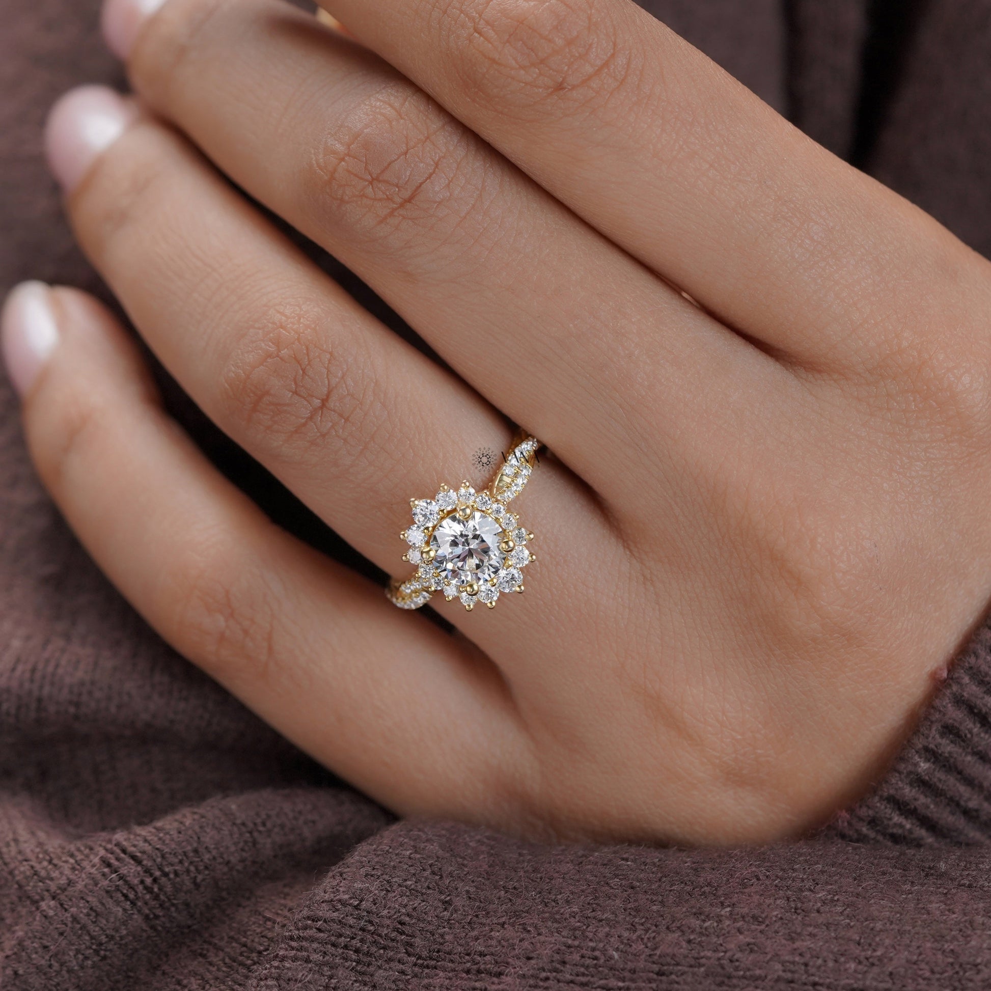 Hand model wearing floral halo moissanite engagement ring