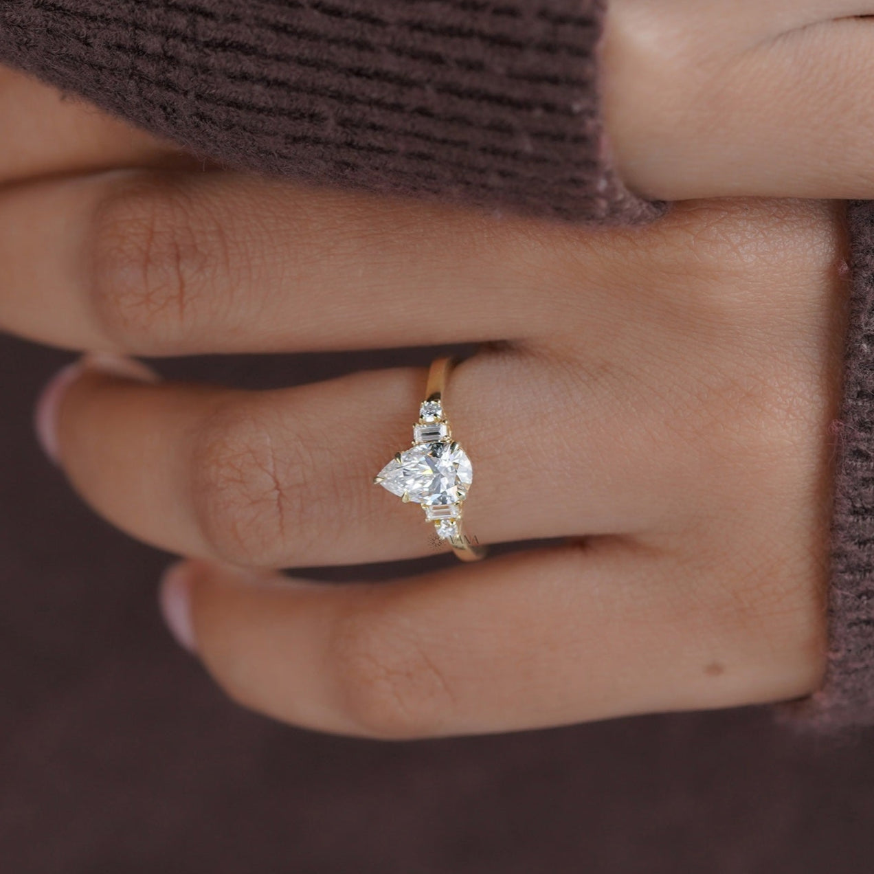 Classic five stone pear moissanite ring in 14K gold band