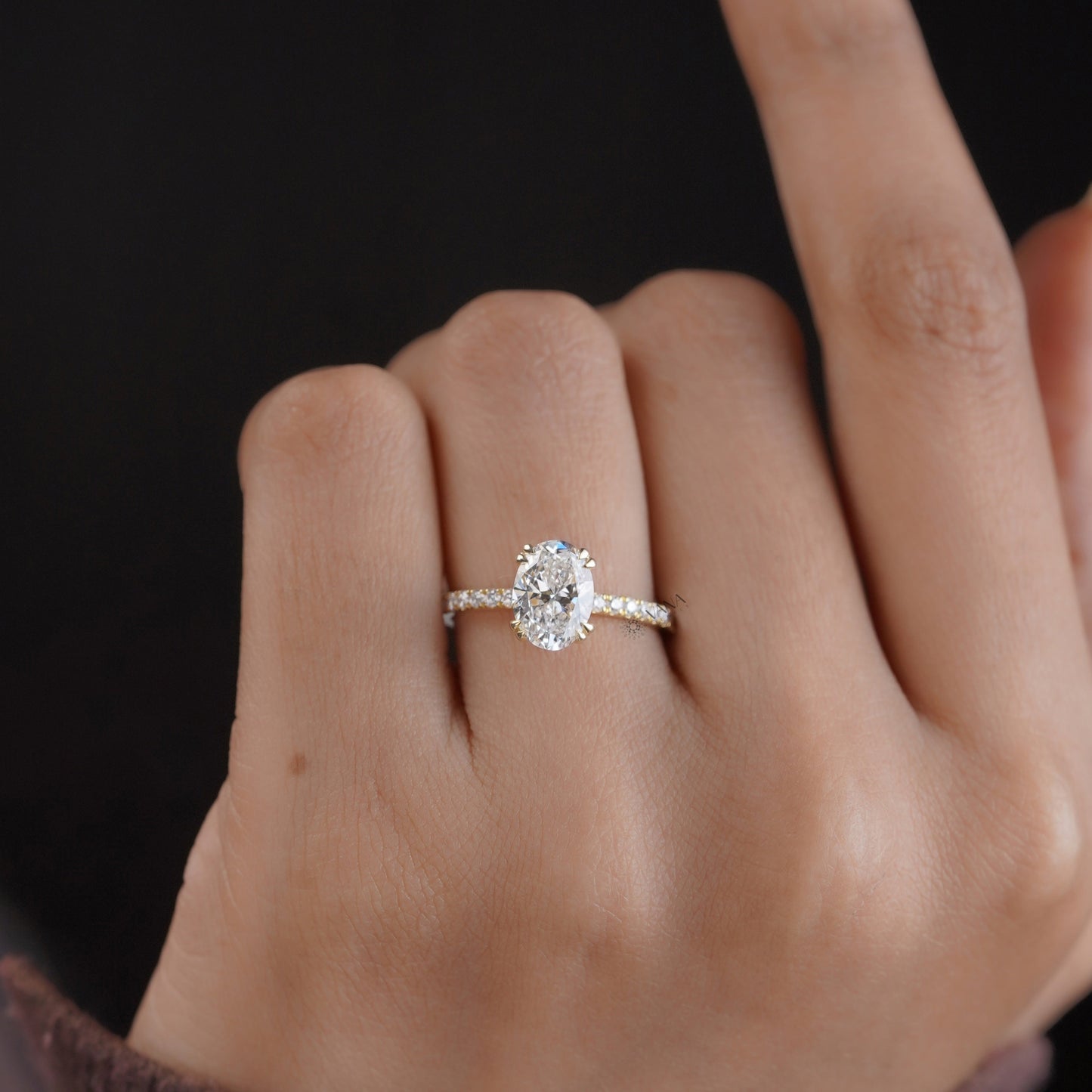 Oval cut moissanite pave set engagement ring