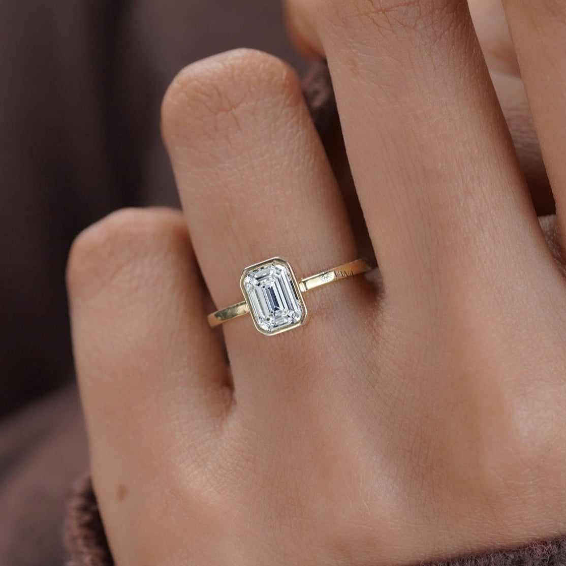 Emerald solitaire moissanite engagement ring