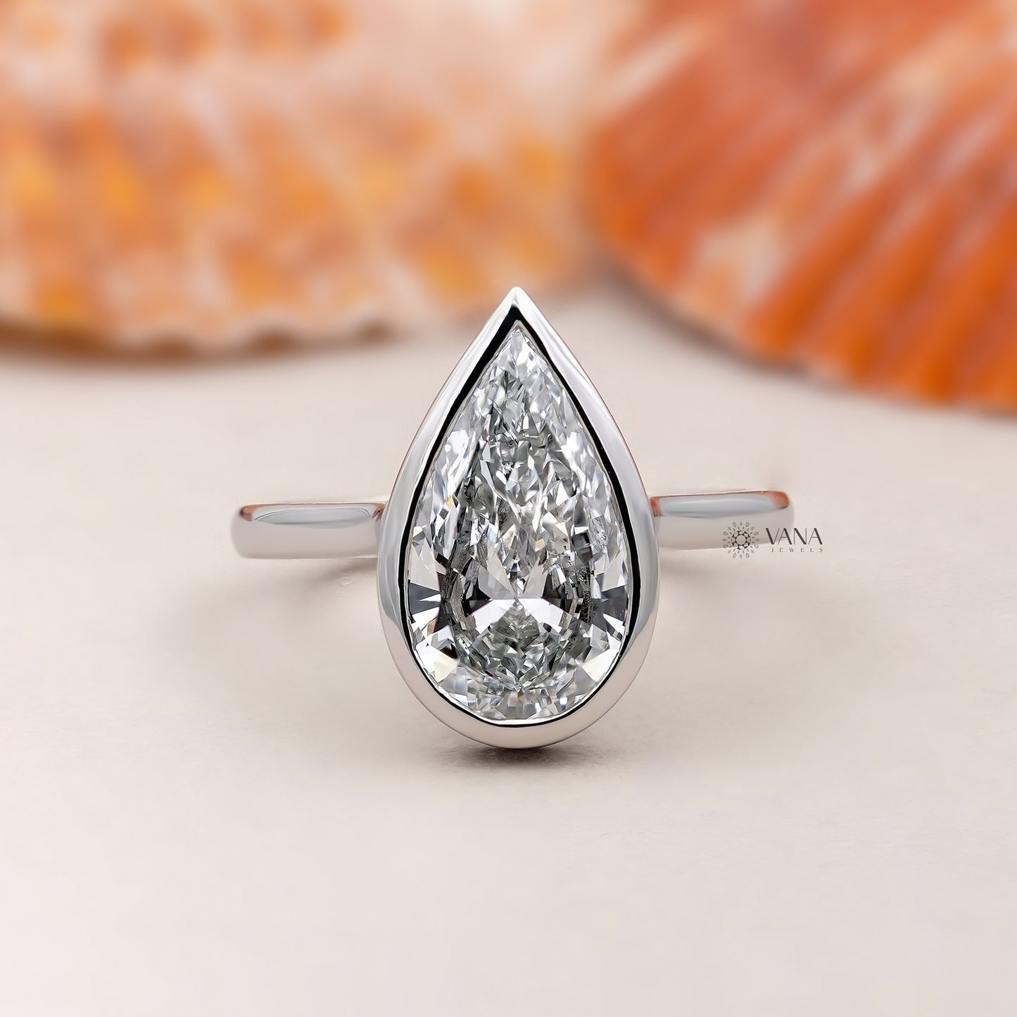 Bezel Set Pear Cut Lab Grown Diamond Solitaire Ring with Hidden Halo Setting