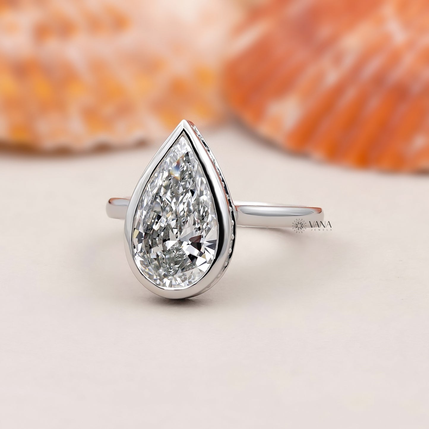 Bezel Set Pear Cut Lab Grown Diamond Solitaire Ring with Hidden Halo Setting