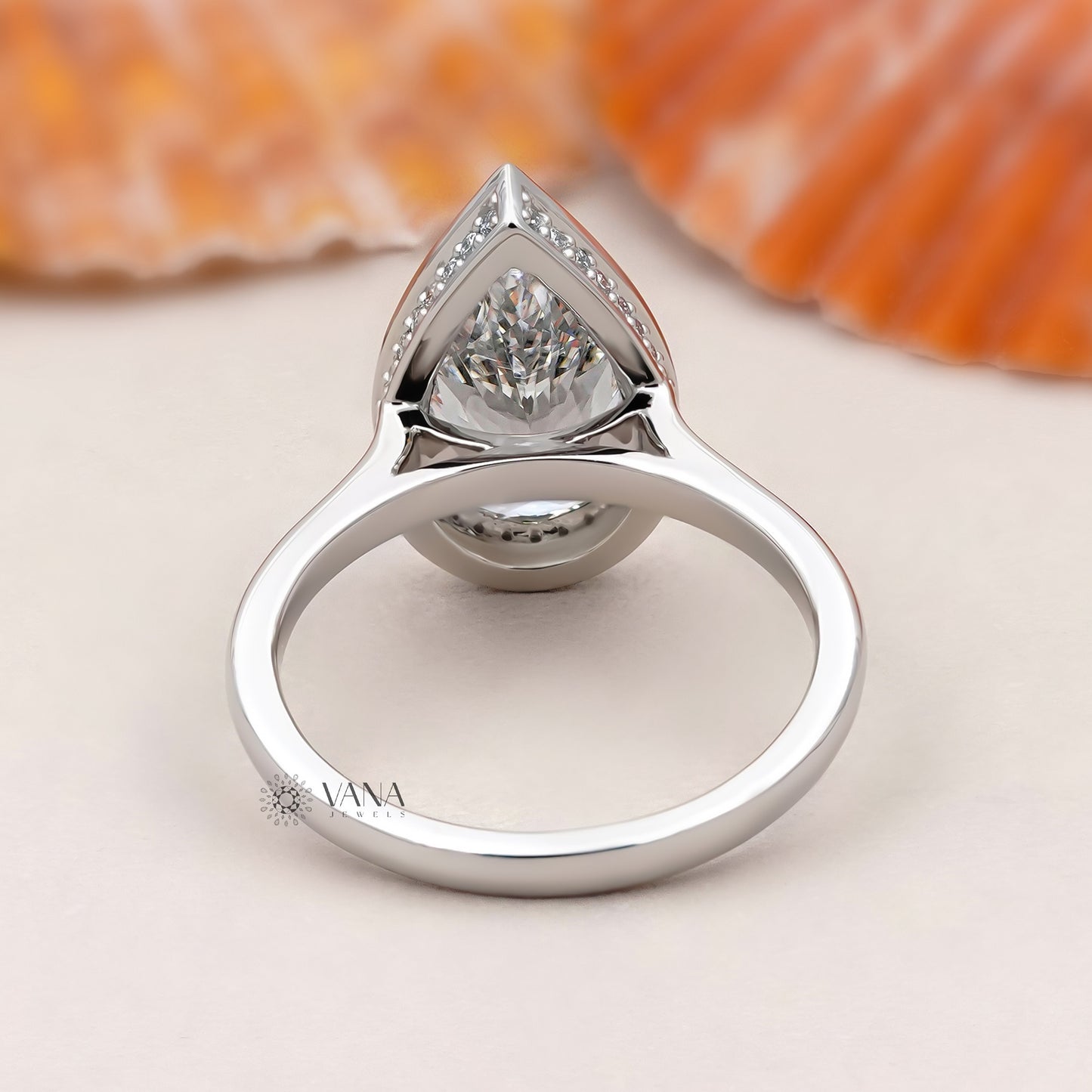 Bezel Set Pear Cut Lab Grown Diamond Solitaire Ring with Hidden Halo Setting