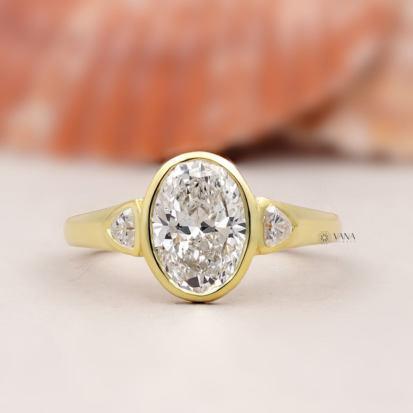 Oval Lab Grown Diamond Bezel Engagement Ring with Trillion Side Stones and Tapered Gold Band