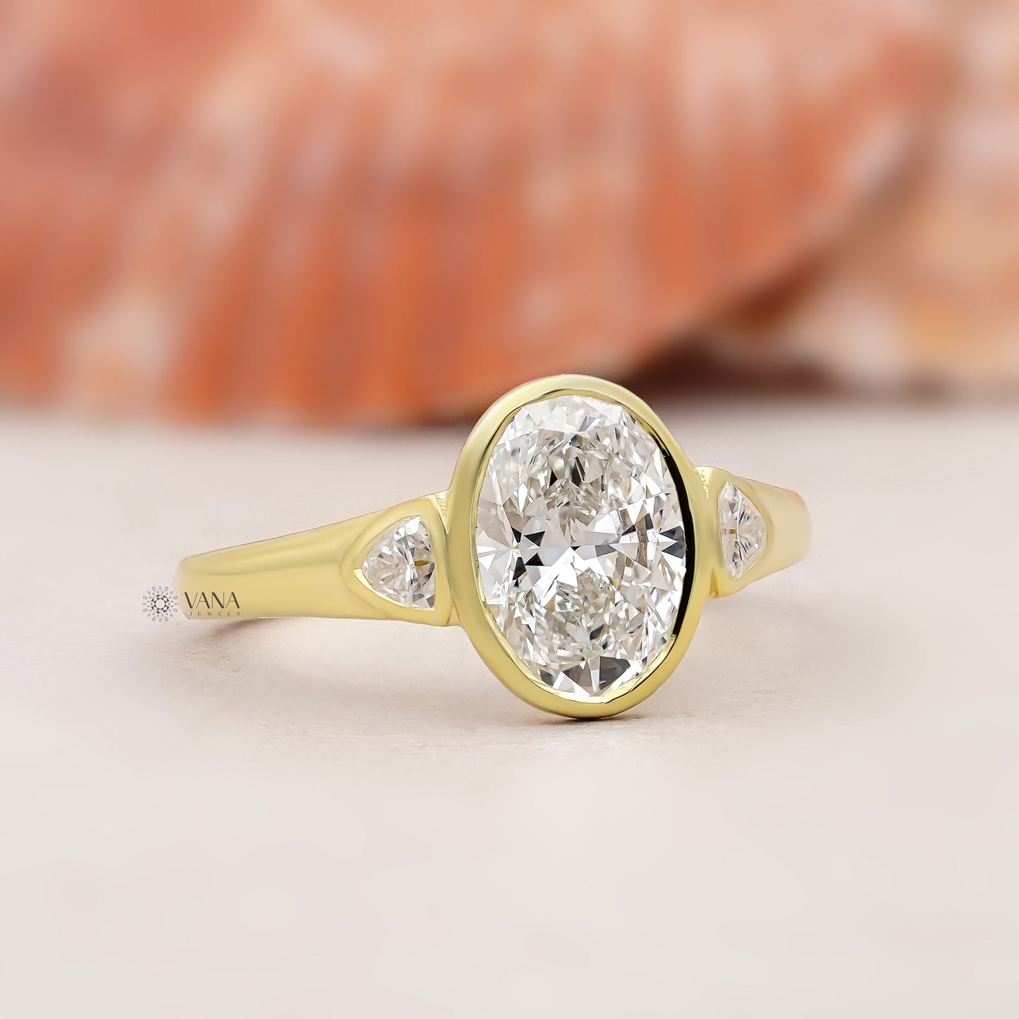 Oval Lab Grown Diamond Bezel Engagement Ring with Trillion Side Stones and Tapered Gold Band