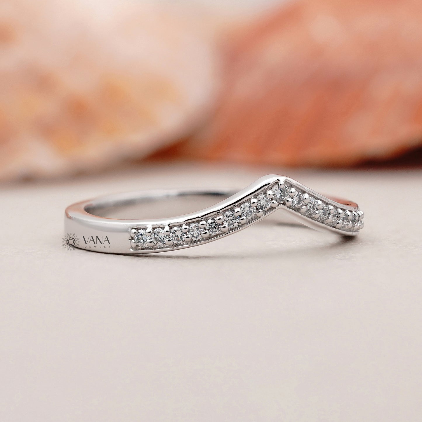 Curved white gold wedding band with sparkling round lab grown diamonds