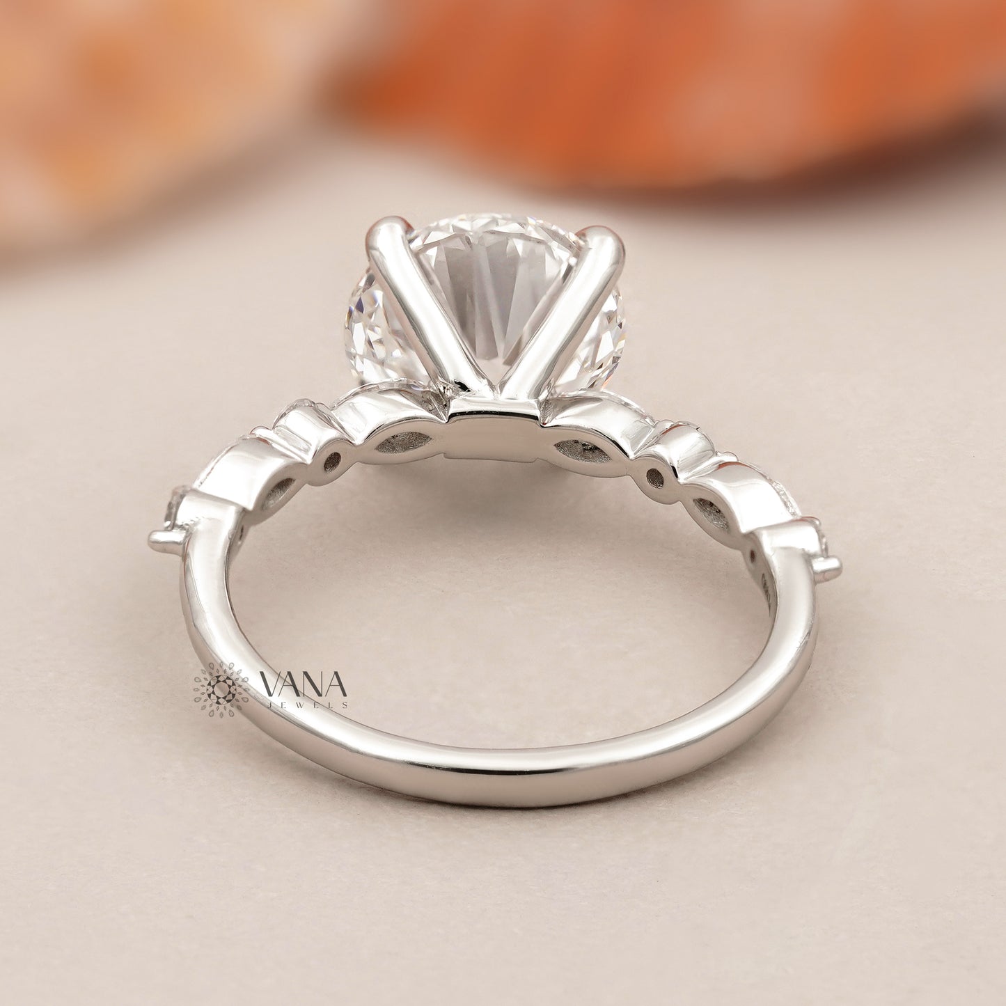 Round Cut Lab Grown Diamond Engagement Ring with Marquise and Round Side Stones