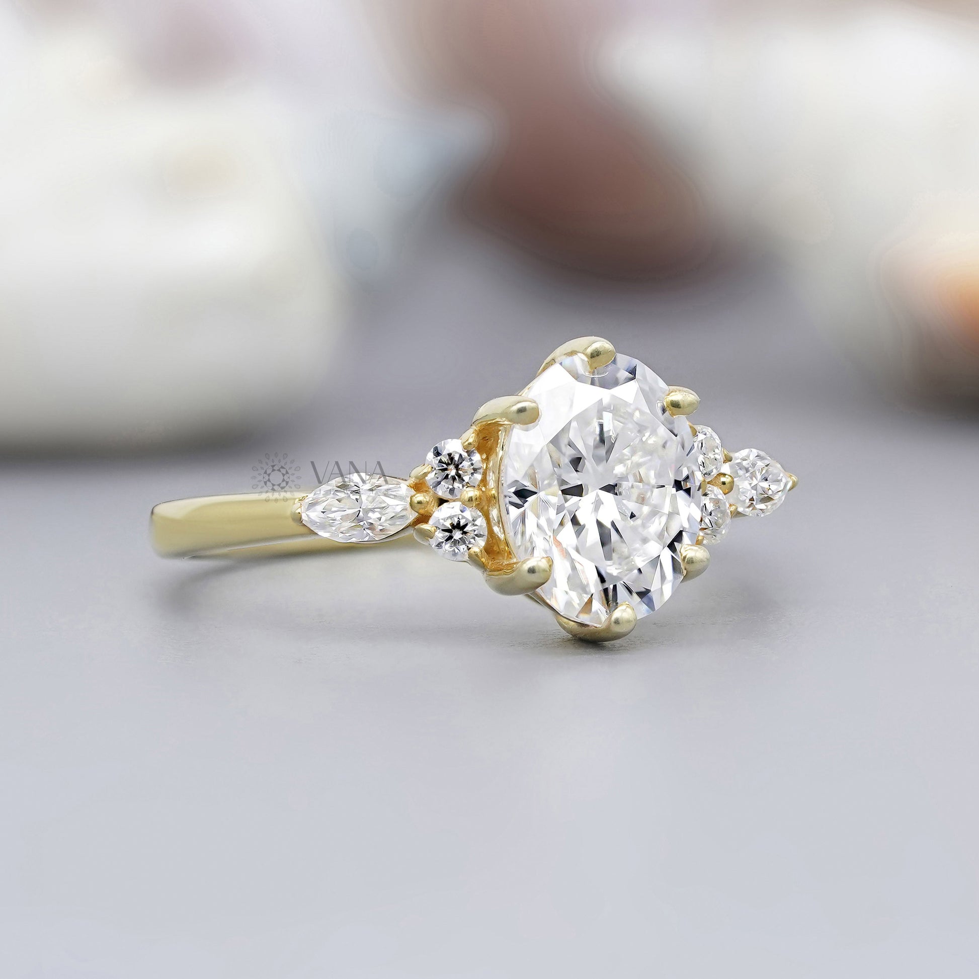 Side stone marquise and round ring