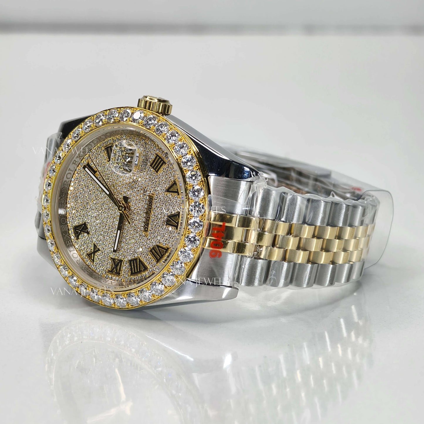 Luxury Two Tone Moissanite Watch with Roman Numeral Dial and Diamond Bezel.