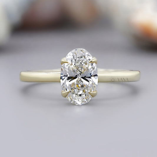 Oval cut moissanite solitaire engagement ring in 14K yellow gold