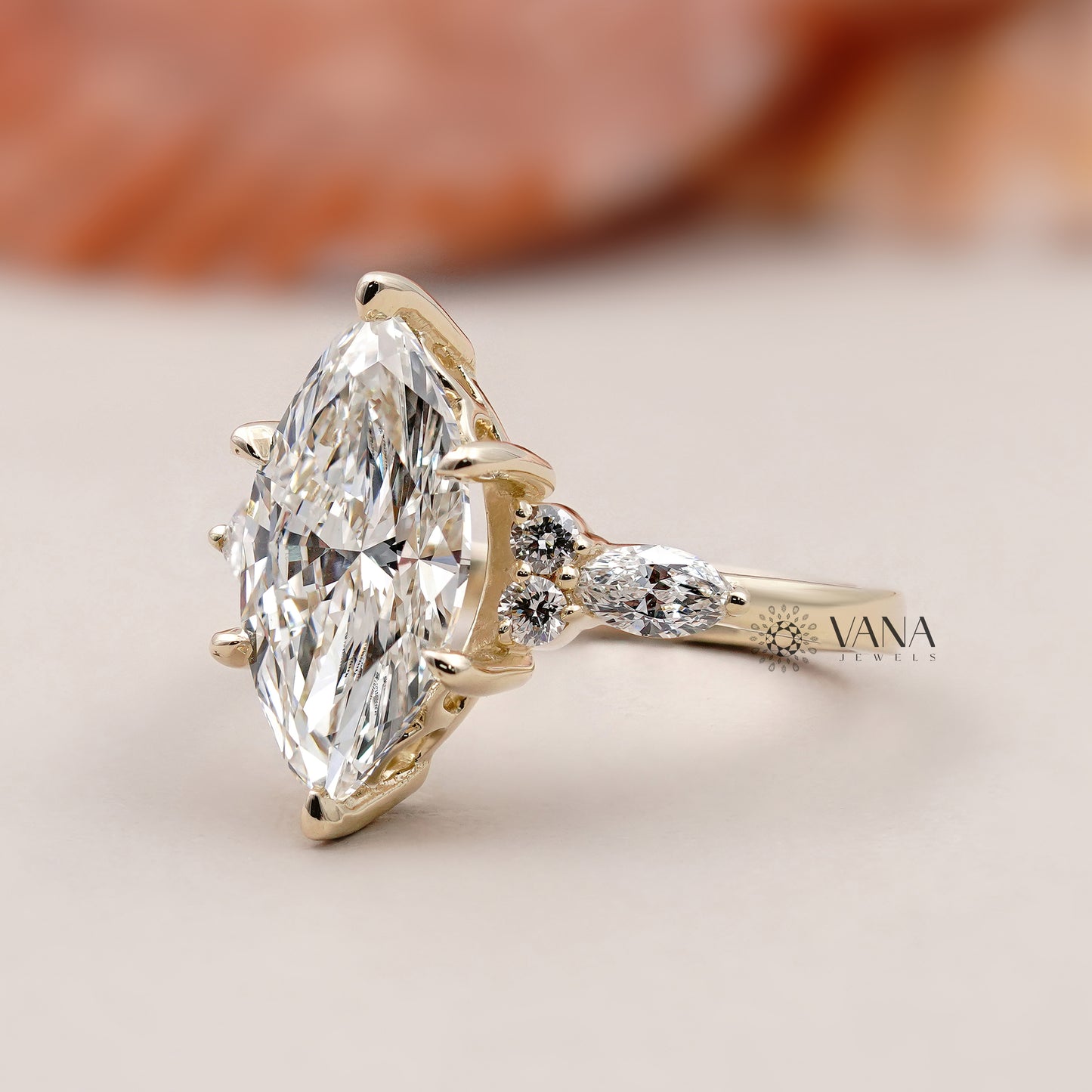 Vintage-inspired marquise shape engagement ring with round brilliant side diamonds