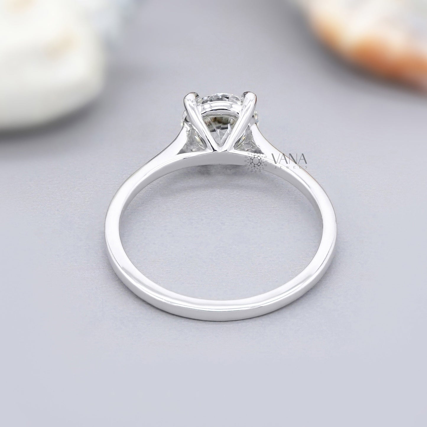 Simple moissanite proposal ring