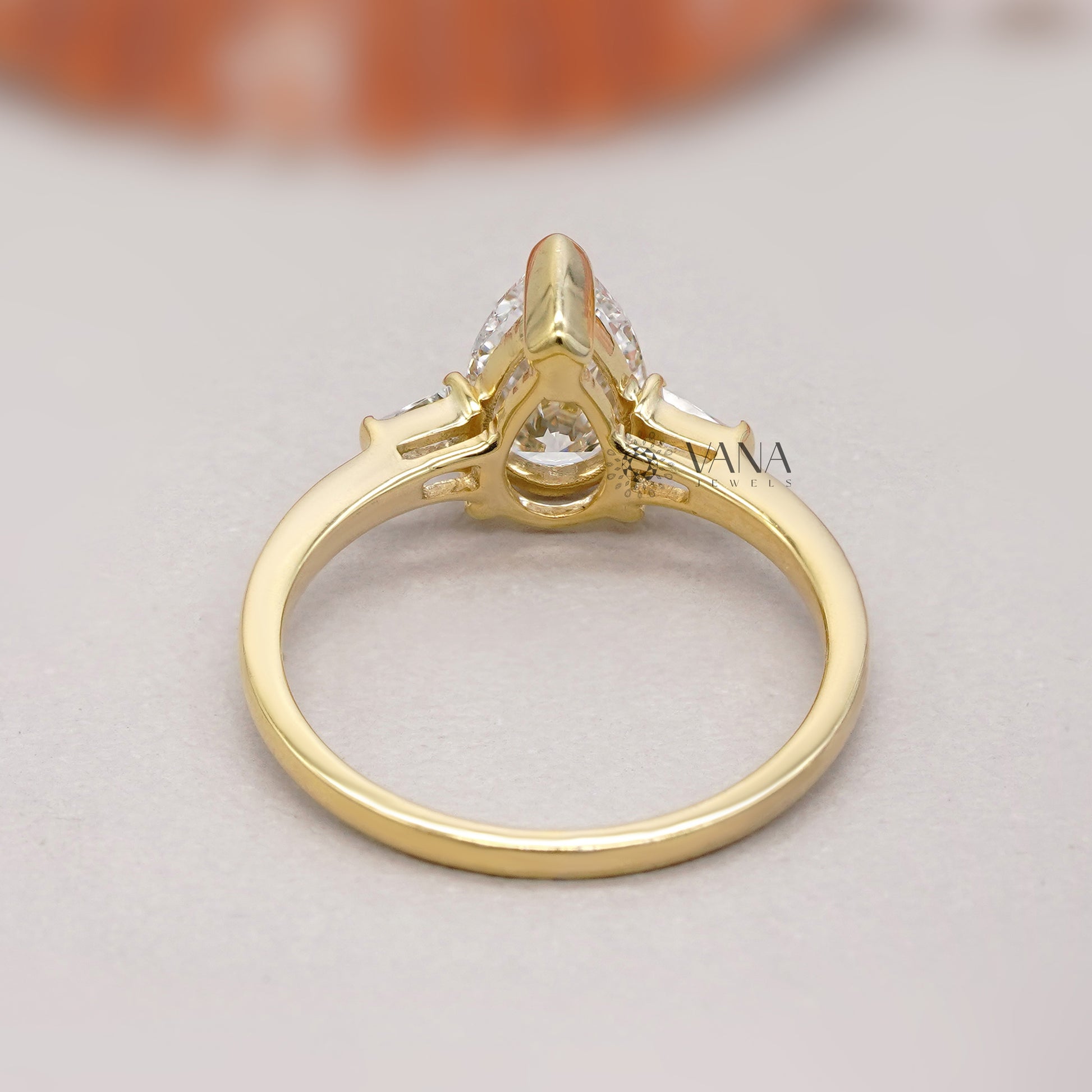 minimalist pear cut diamond proposal ring

