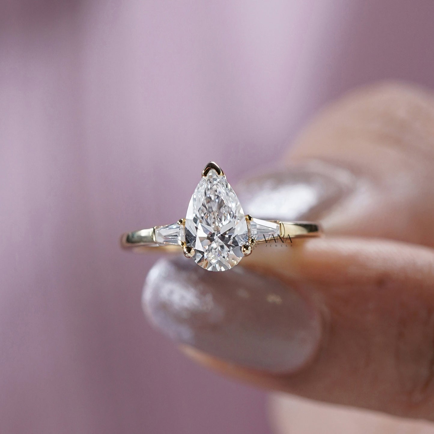 Pear Cut Moissanite Three Stone Engagement Ring with Tapered Baguette Side Stones