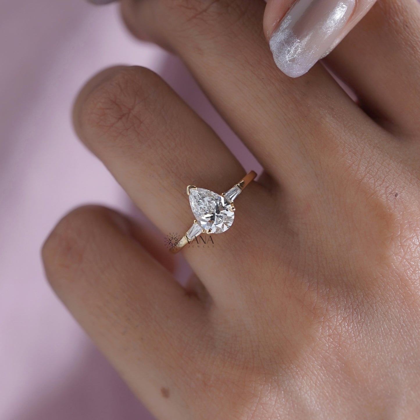 Pear Cut Moissanite Three Stone Engagement Ring with Tapered Baguette Side Stones