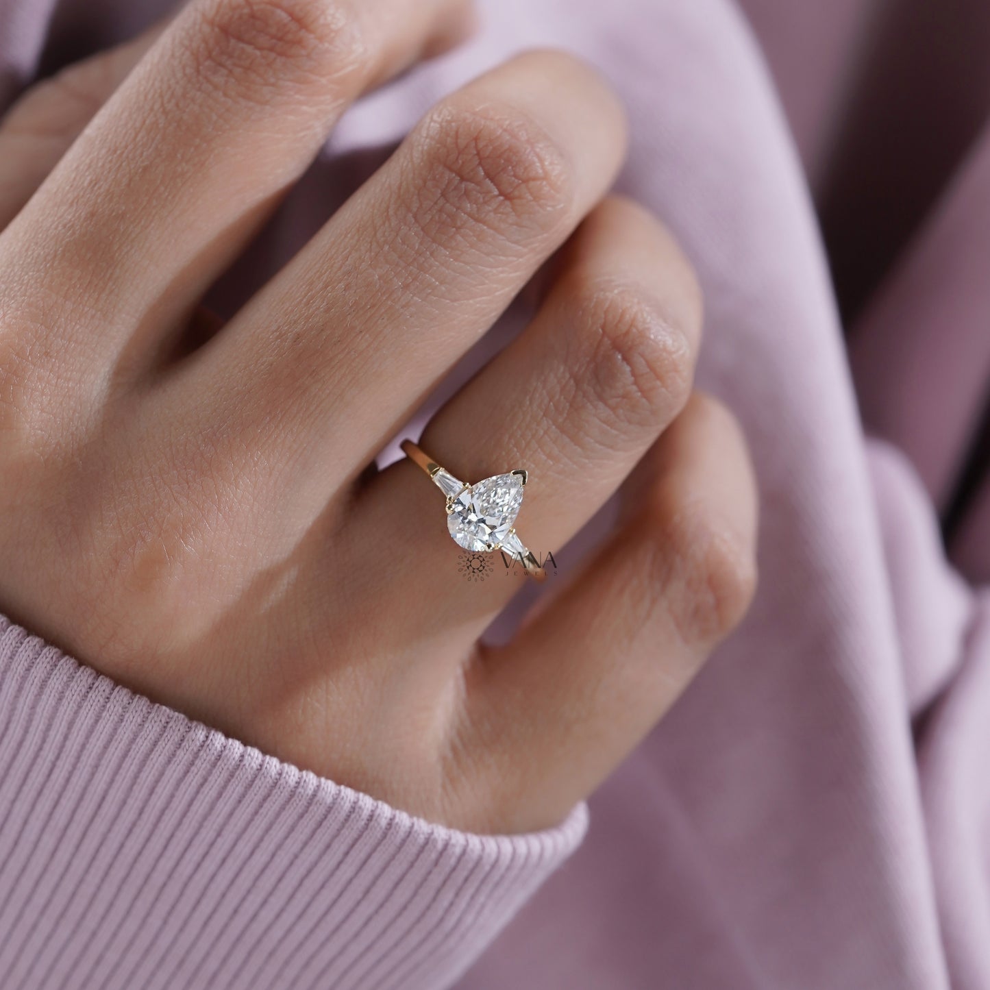 Pear Cut Moissanite Three Stone Engagement Ring with Tapered Baguette Side Stones