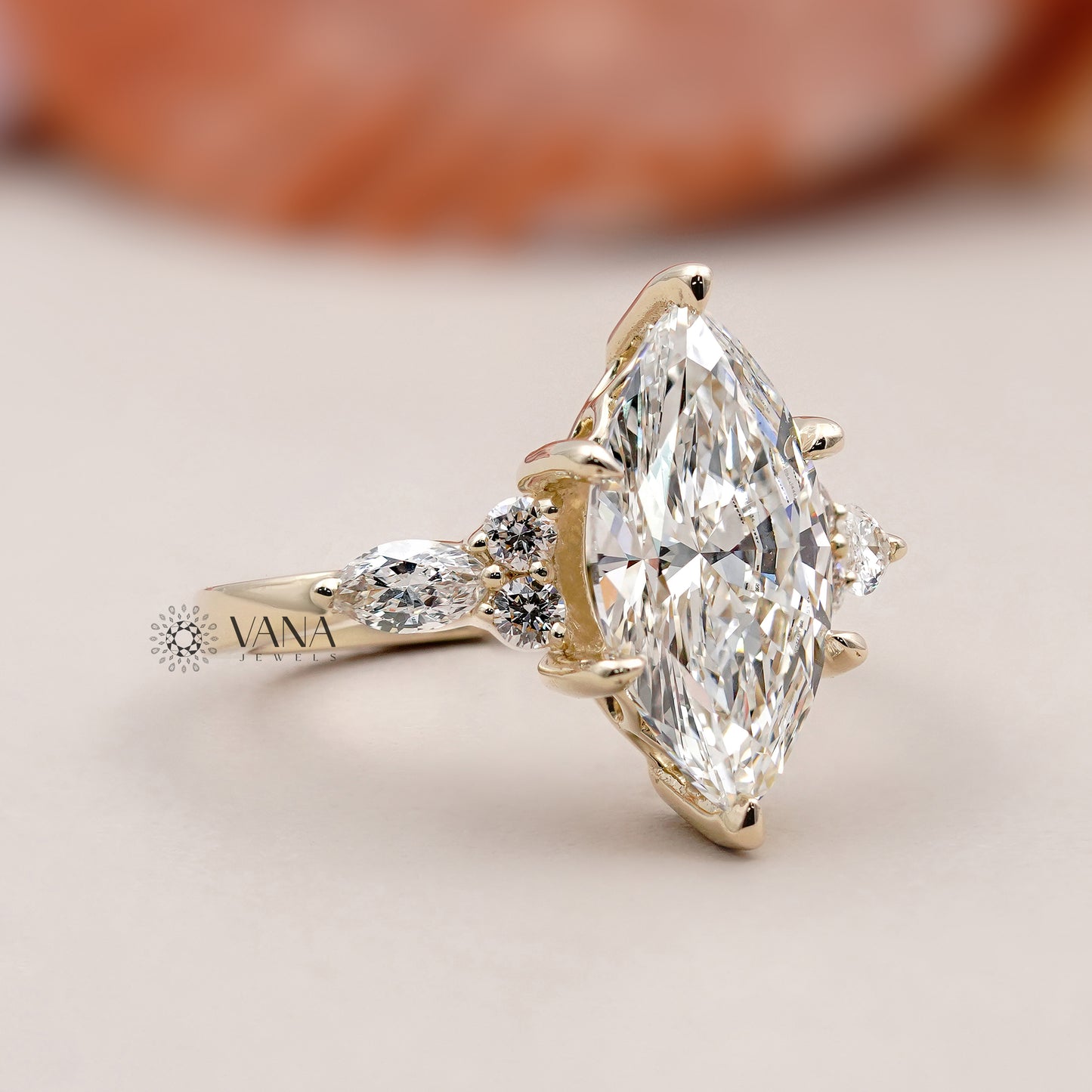 Vintage-inspired marquise shape engagement ring with round brilliant side diamonds