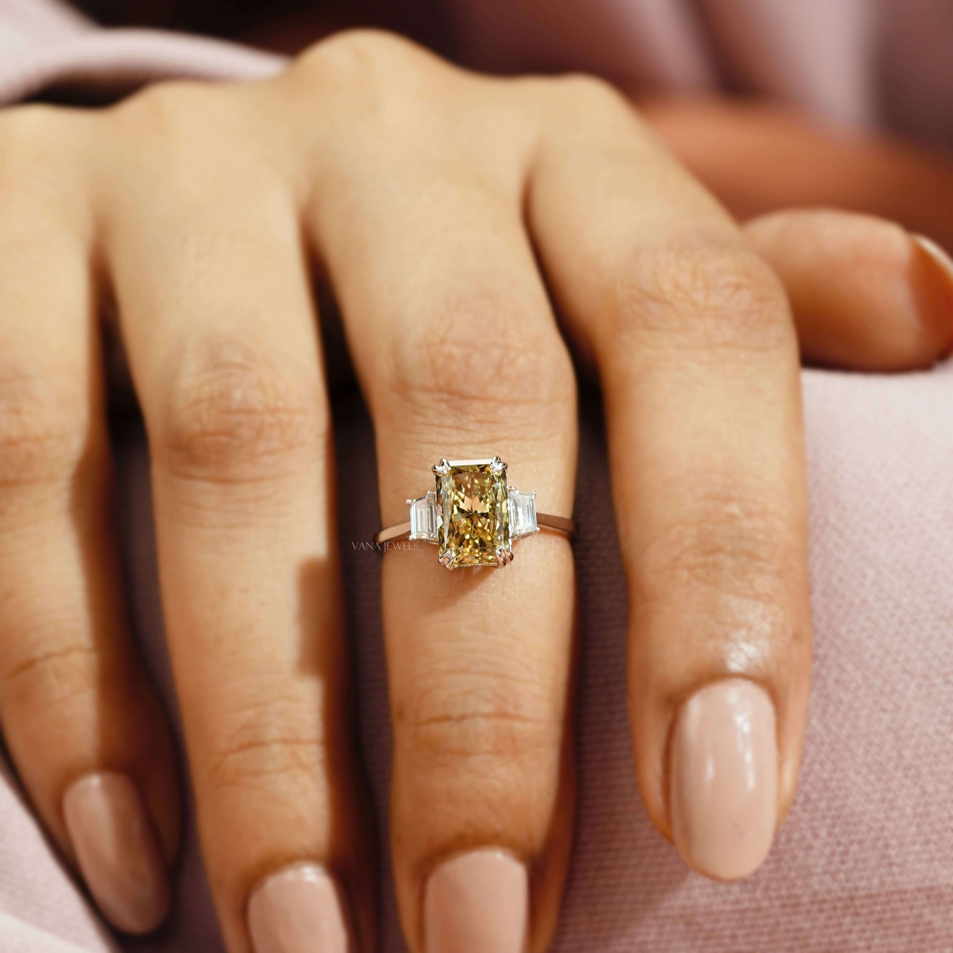 three stone engagement ring with trapezoid sides