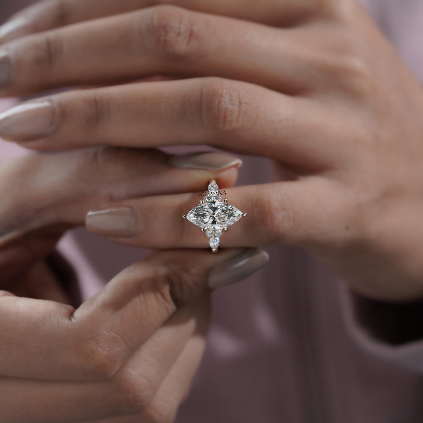 Vintage-inspired marquise shape engagement ring with round brilliant side diamonds