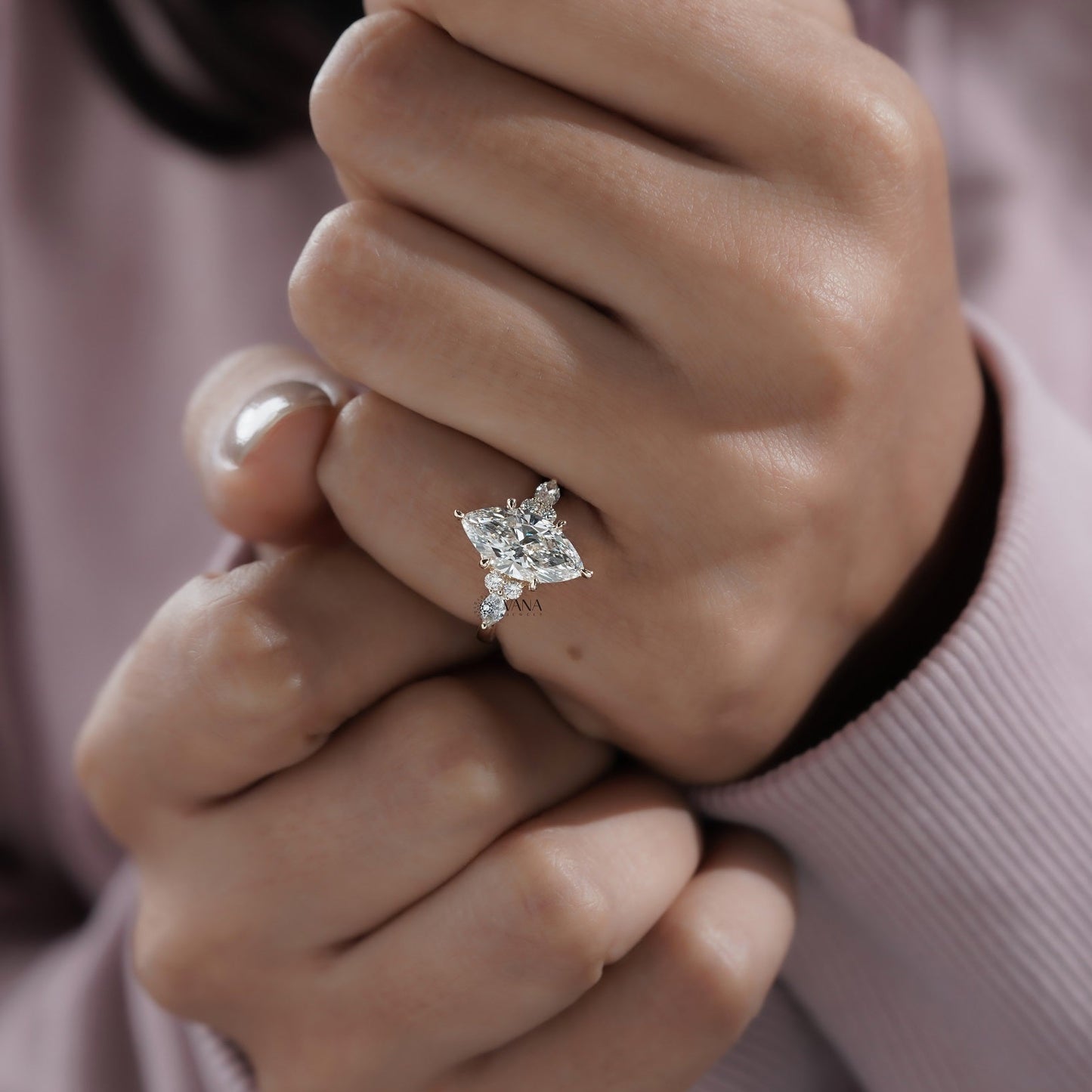 Vintage-inspired marquise shape engagement ring with round brilliant side diamonds