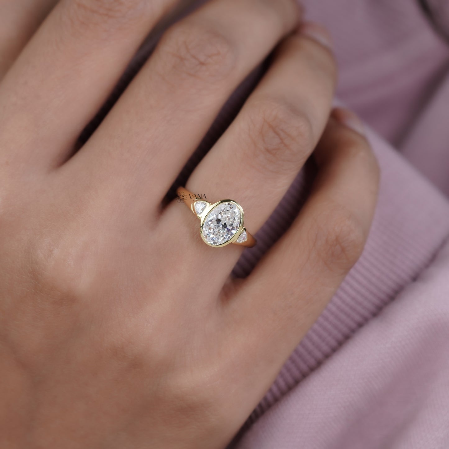 Oval Lab Grown Diamond Bezel Engagement Ring with Trillion Side Stones and Tapered Gold Band