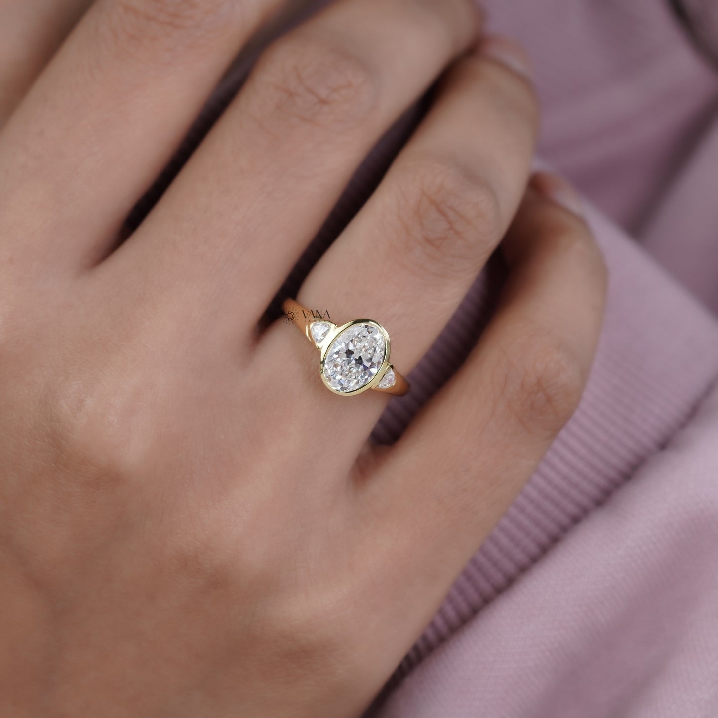 Oval Cut Moissanite Three Stone Bezel Set Engagement Ring in Yellow Gold