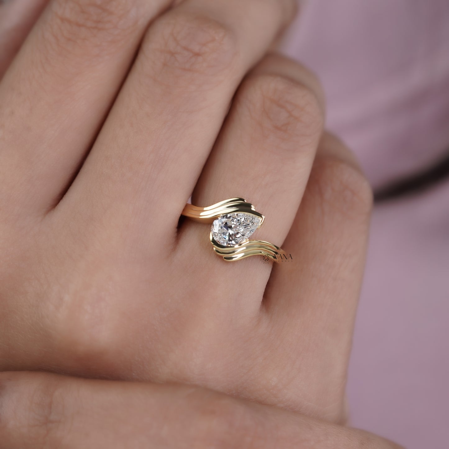 Pear Cut Lab Grown Diamond Solitaire Engagement Ring with Unique Bypass Shank