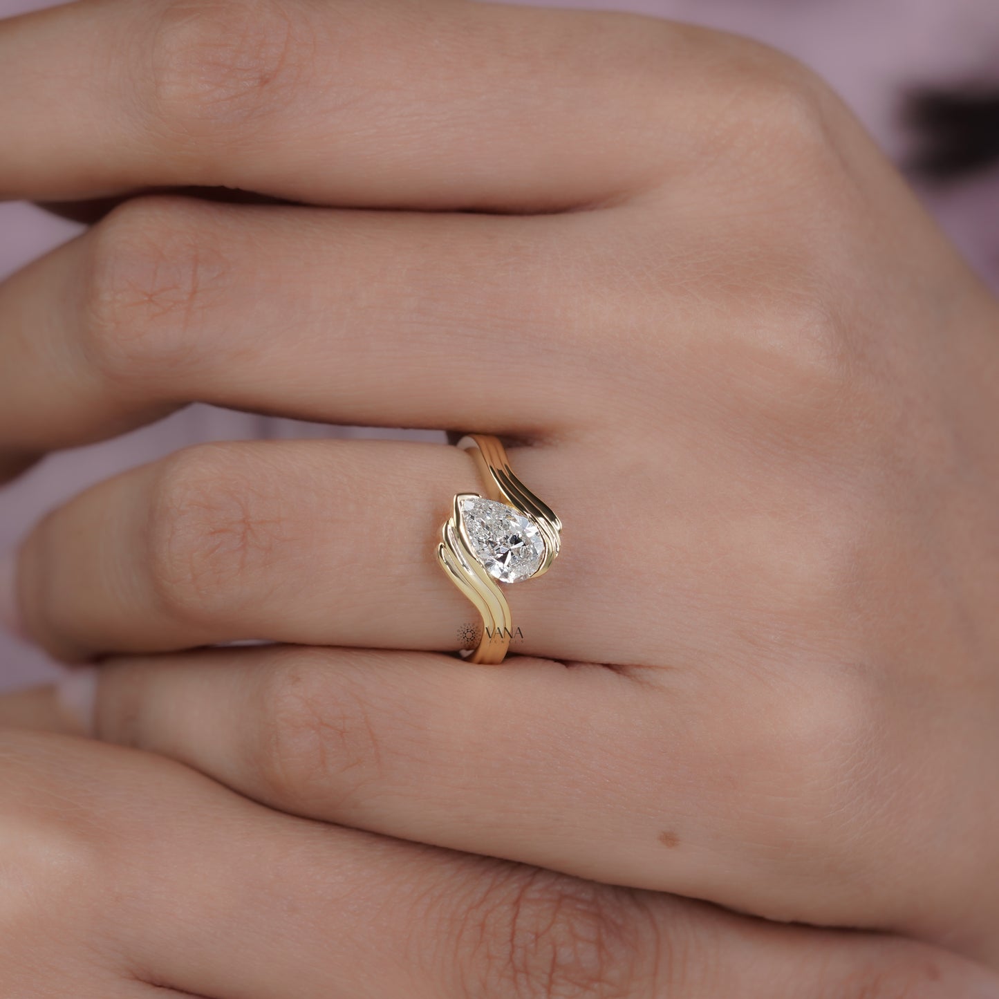 Pear Cut Lab Grown Diamond Solitaire Engagement Ring with Unique Bypass Shank